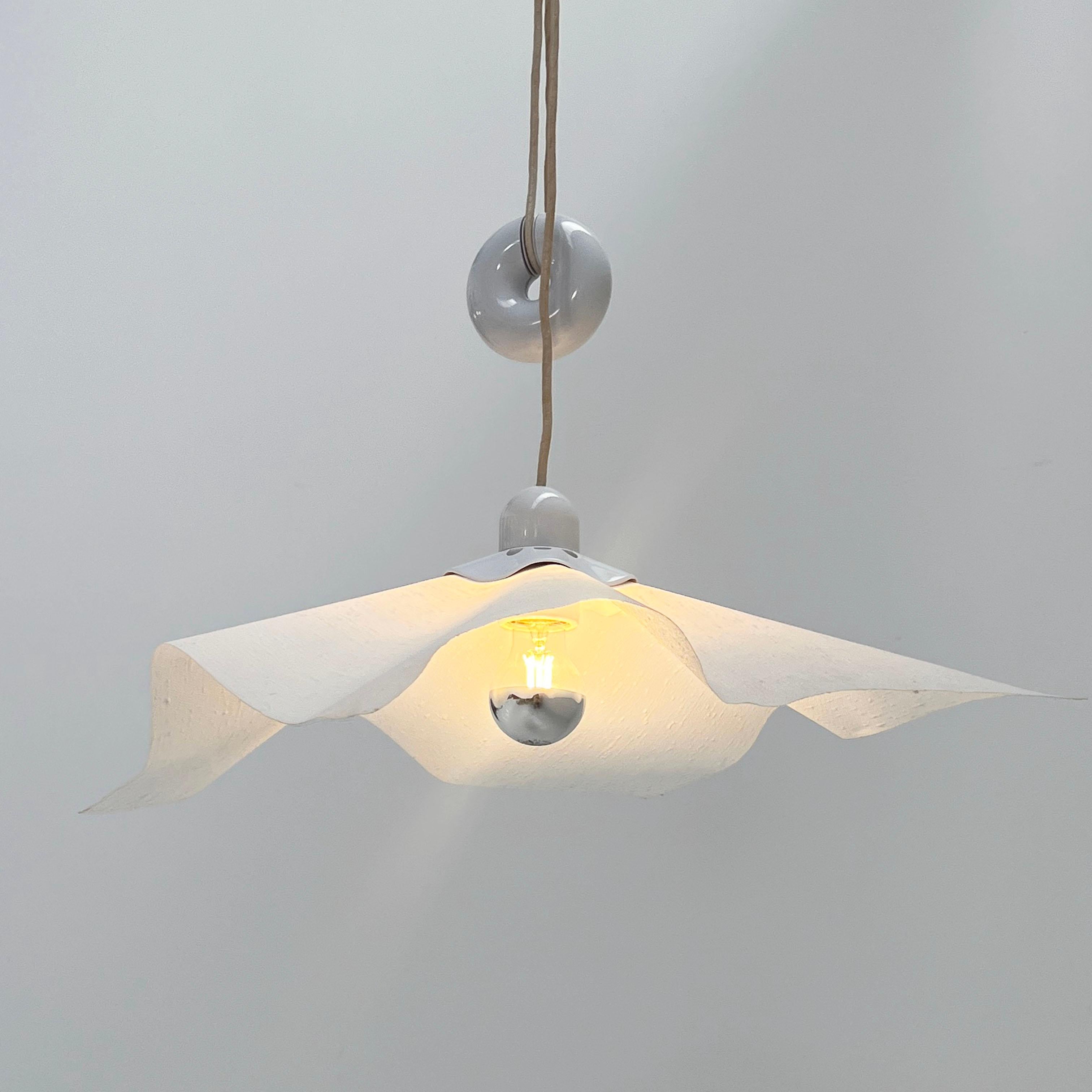 Designer - Mario Bellini
Producer - Artemide
Model - Area 50 Ceiling Light
Design Period - Seventies
Measurements - Width 64 cm x Depth 64 cm x Height 160 cm (Wire)
Materials - Metal, Paper
Color - White
Electrical Properties - Lightbulb