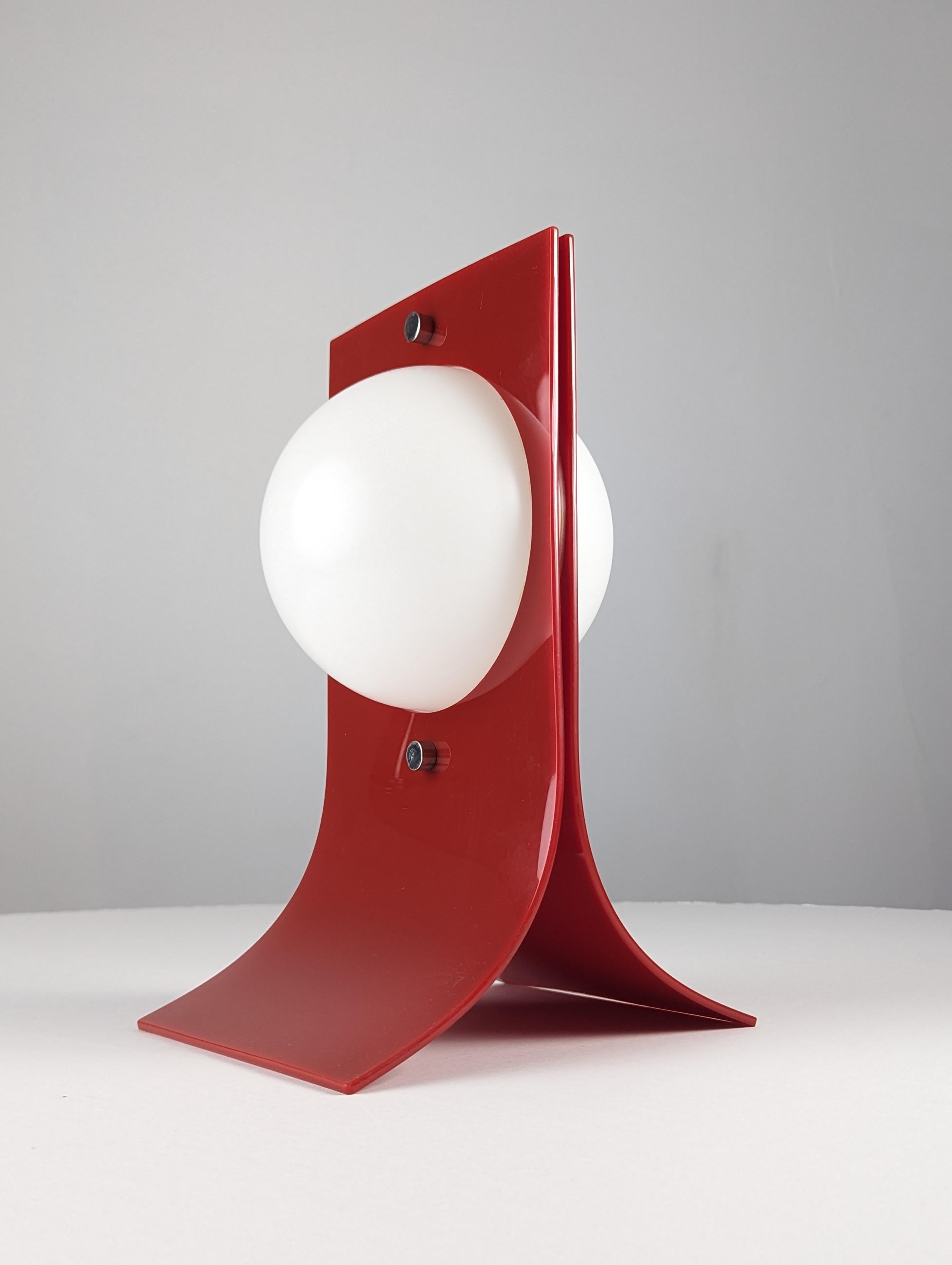 Fantastic Area lamp in an unusual red model attributed to the nicknamed Prince of Plastic by the New York Times, Neal Small. Who spearheaded the design in the late 1960s thanks to his sculptural lighting and furniture made of plastic and acrylic