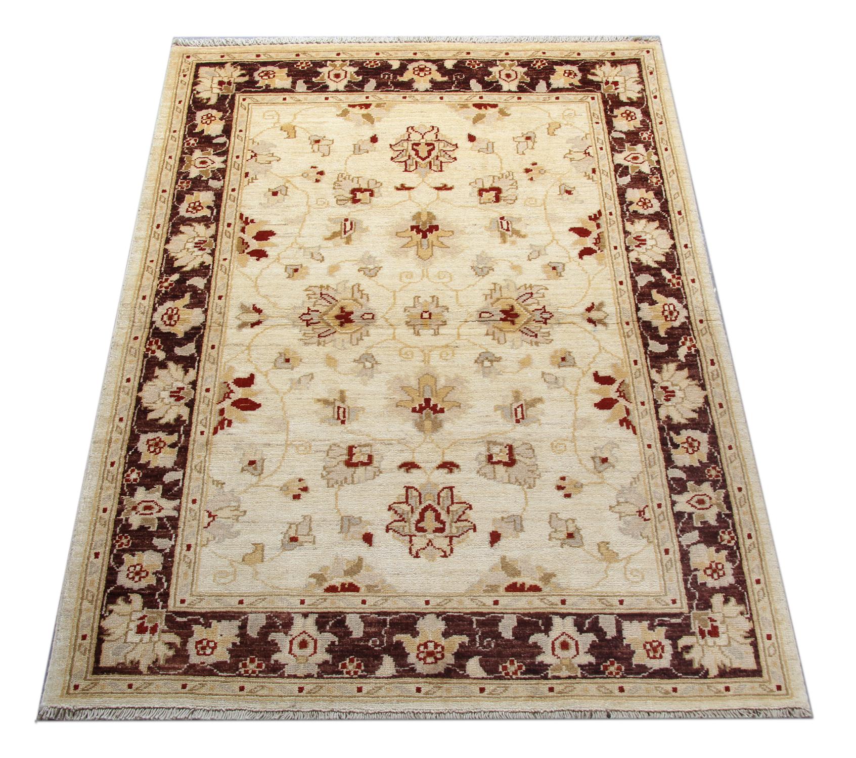 This traditional Ziegler rug is one of our more luxurious rugs made on own looms by our master weavers of Afghan rugs. This cream rug is made with organic vegetable dyes all handspun wool rugs. This carpet features an all-over floral design with an