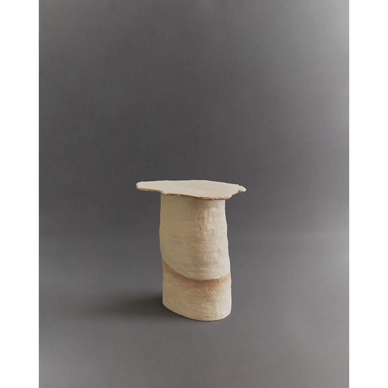 Arena clay side table by Ombia
Dimensions: W 36 x D 25.5 x H 48.5 cm
Materials: Clay, unglazed. 
Custom colors upon request.


Ombia is a ceramic sculpture and design studio based in Los Angeles. The name and its roots originates from