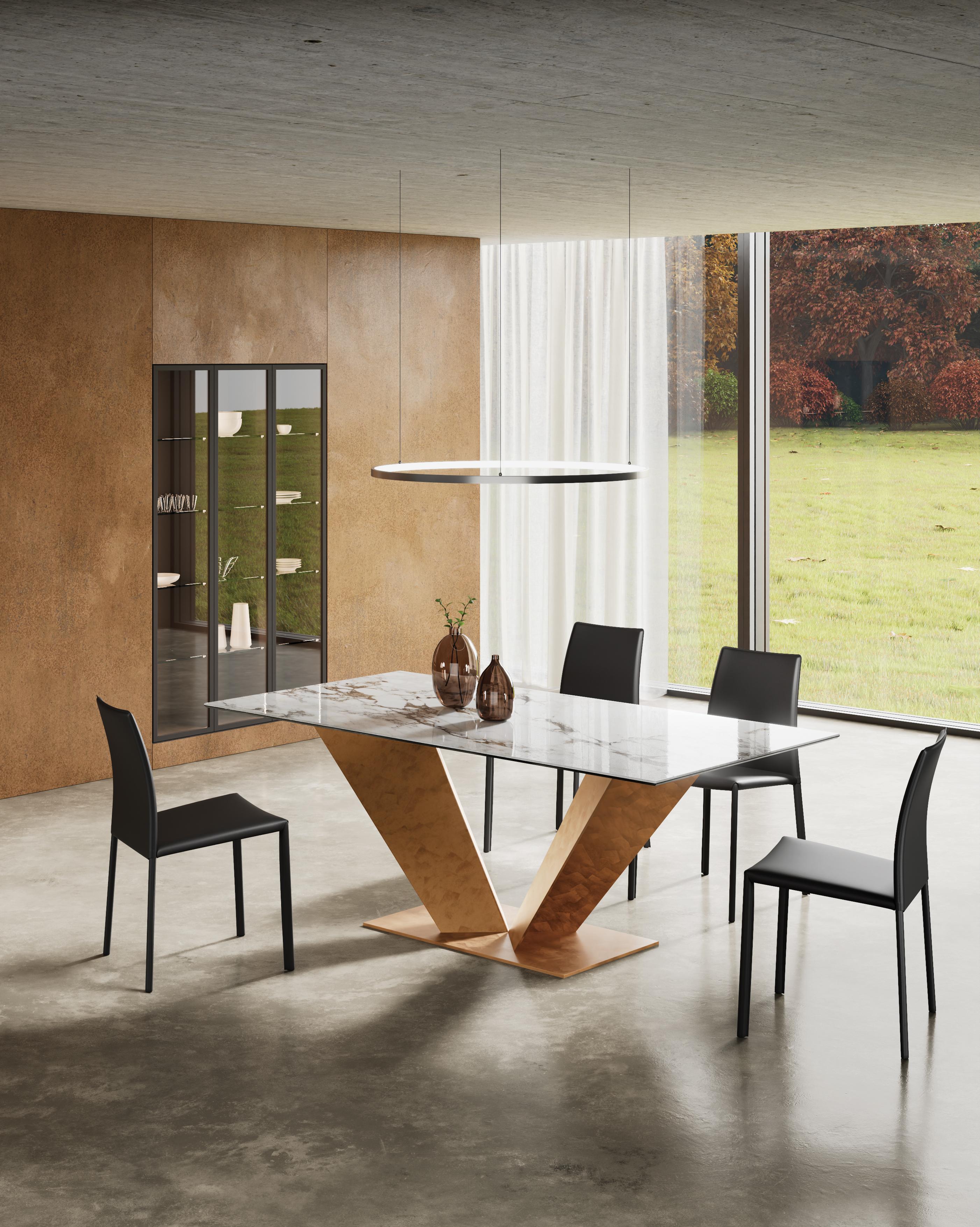 Ares Dining Table by Chinellato Design
Dimensions: W 250 x D 120 x H 72 cm
Materials:
Top: Capraia glossy Ceramic top and an Extra Clear Tempered Glass under-top.
Base: Large Piece Copper Leaf finish.


Ares, a rectangular dining table available in