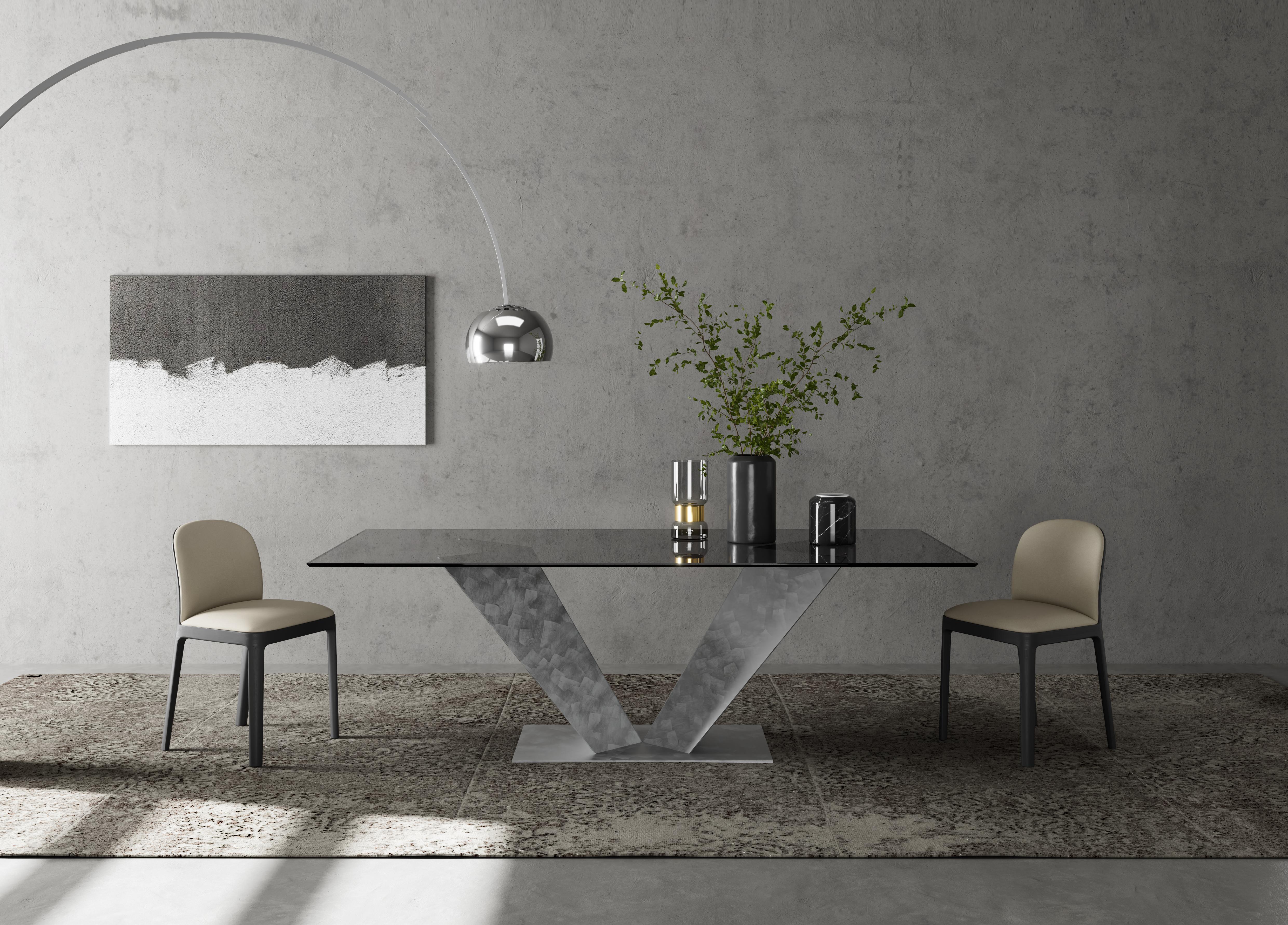 Ares Dining Table by Chinellato Design
Dimensions: W 250 x D 120 x H 72 cm
Materials:
Top: Smooth Smoked Tempered Glass
Base: Silver Large Pieces finish.


Ares, a rectangular dining table available in three sizes, offered with three combinations of