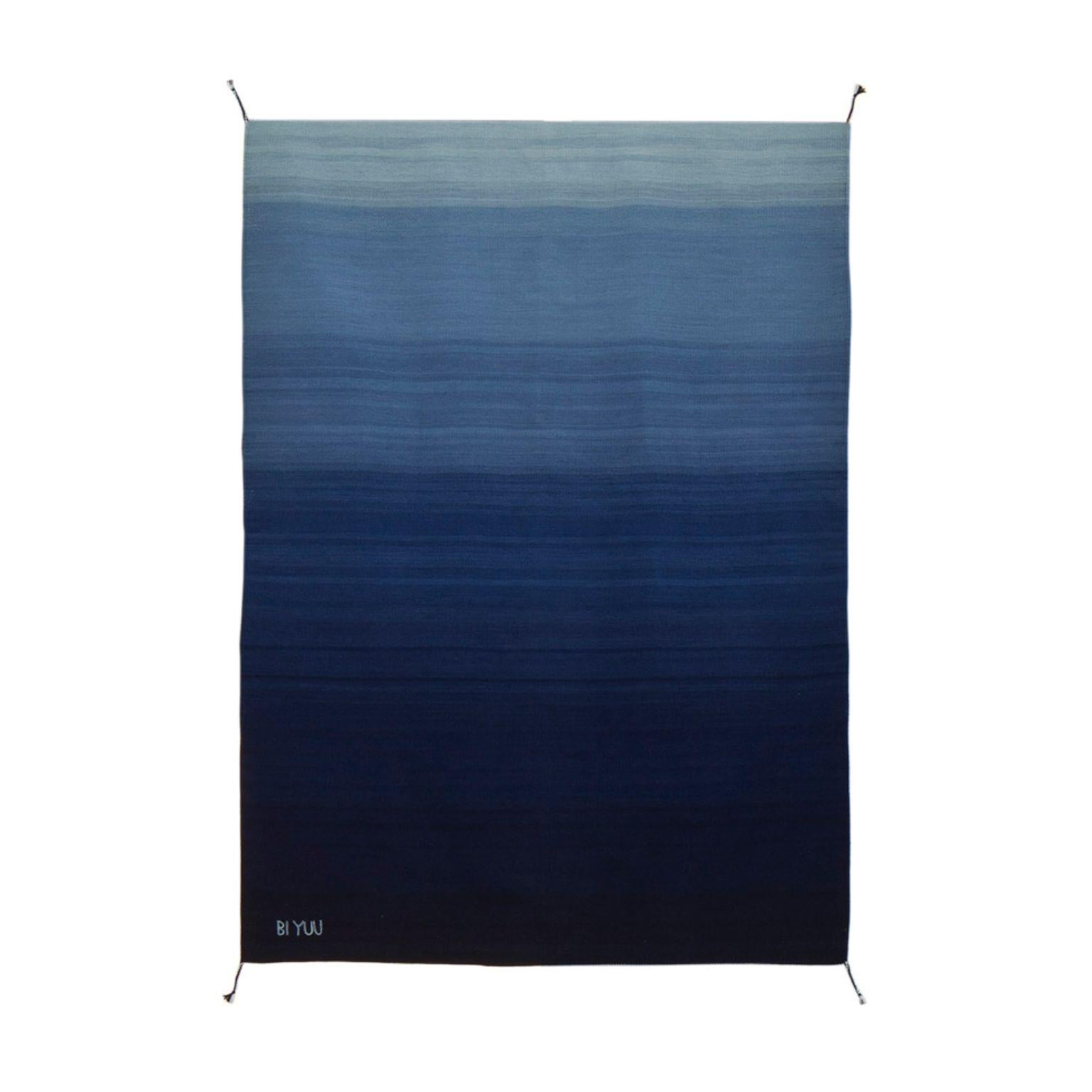 Ares II AII02 Rug by Bi Yuu
Dimensions: D200 x 300 H cm
Material: 70% Lincoln Wool / 30% Merino Wool
Density: 2800 yam passes per m2.
Also Available in different dimensions. Dye: Natural and Colorants.

She founded Bi Yuu with the vision that