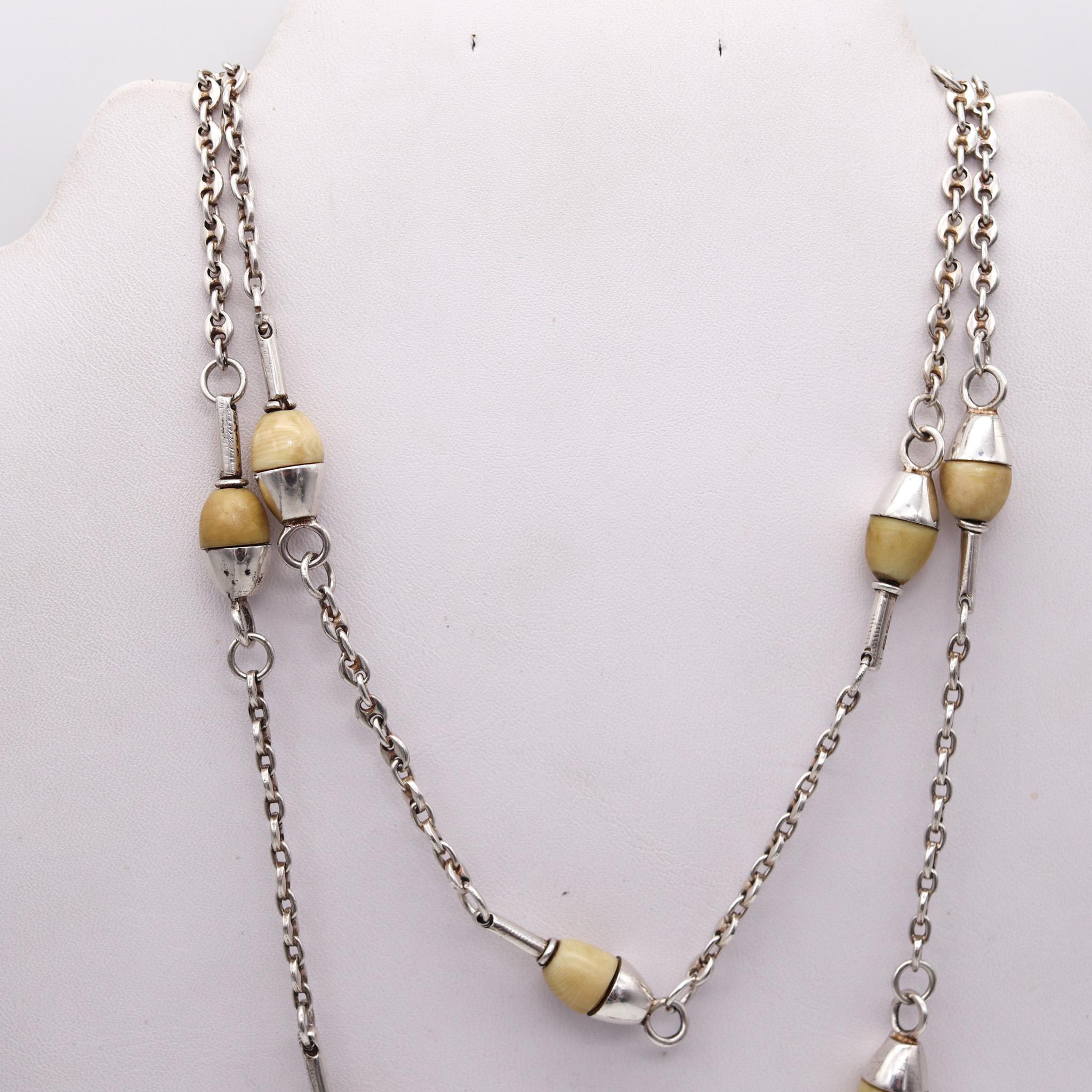 Modernist long sautoir necklace made in Arezzo.

Retro modernist long necklace, created in the city of Arezzo Italy, back in the 1960. Crafted as a long chain sautoir in solid .925/.999 sterling silver. The chain's sections with the Gucci links, are