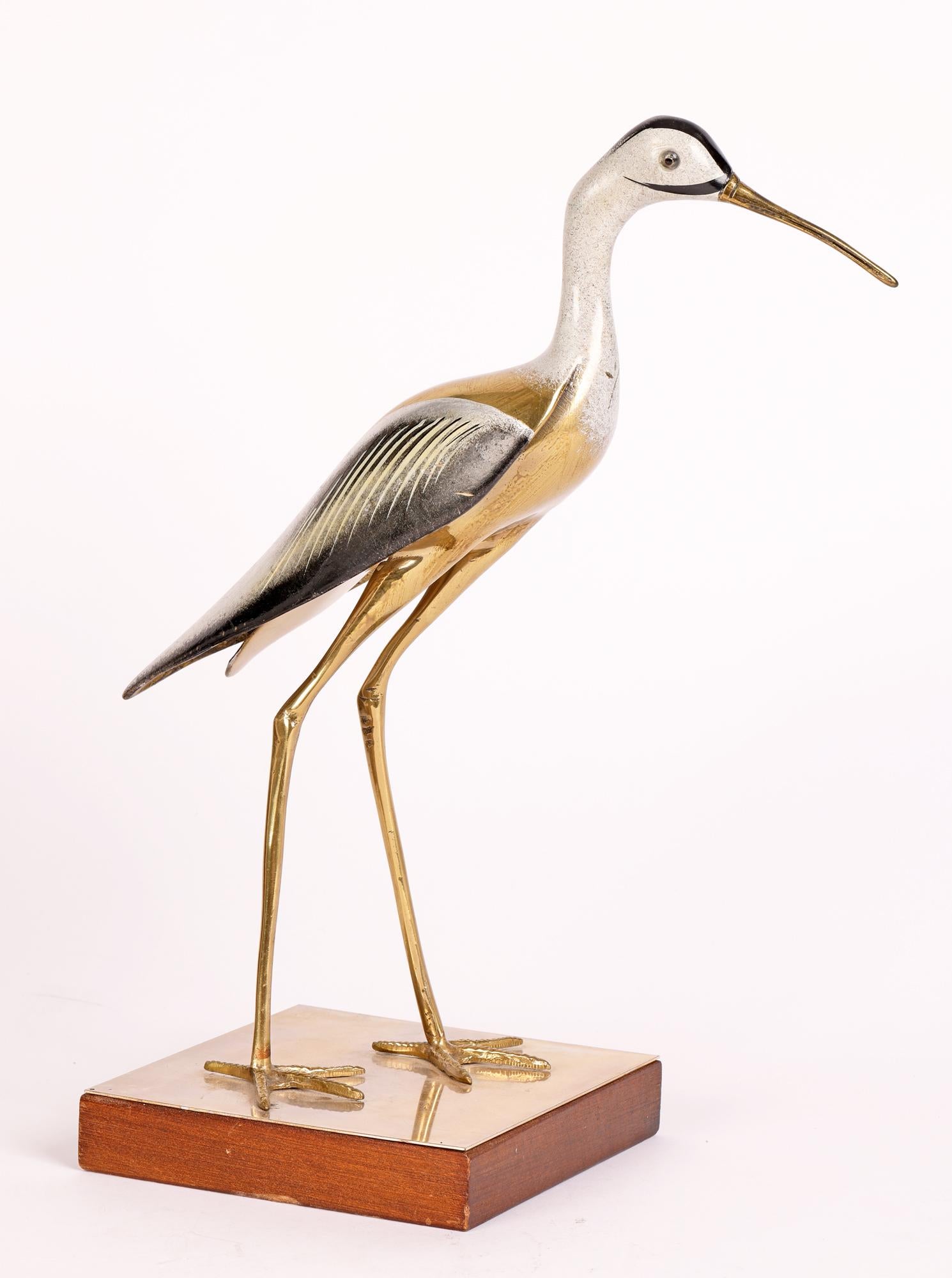A very stylish pair Italian mid-century enameled metal Heron figures signed Groziella. The large herons are mounted on a square wooden bases applied with a polished brass top. The birds are cast in brass with one standing normally with a closed beak