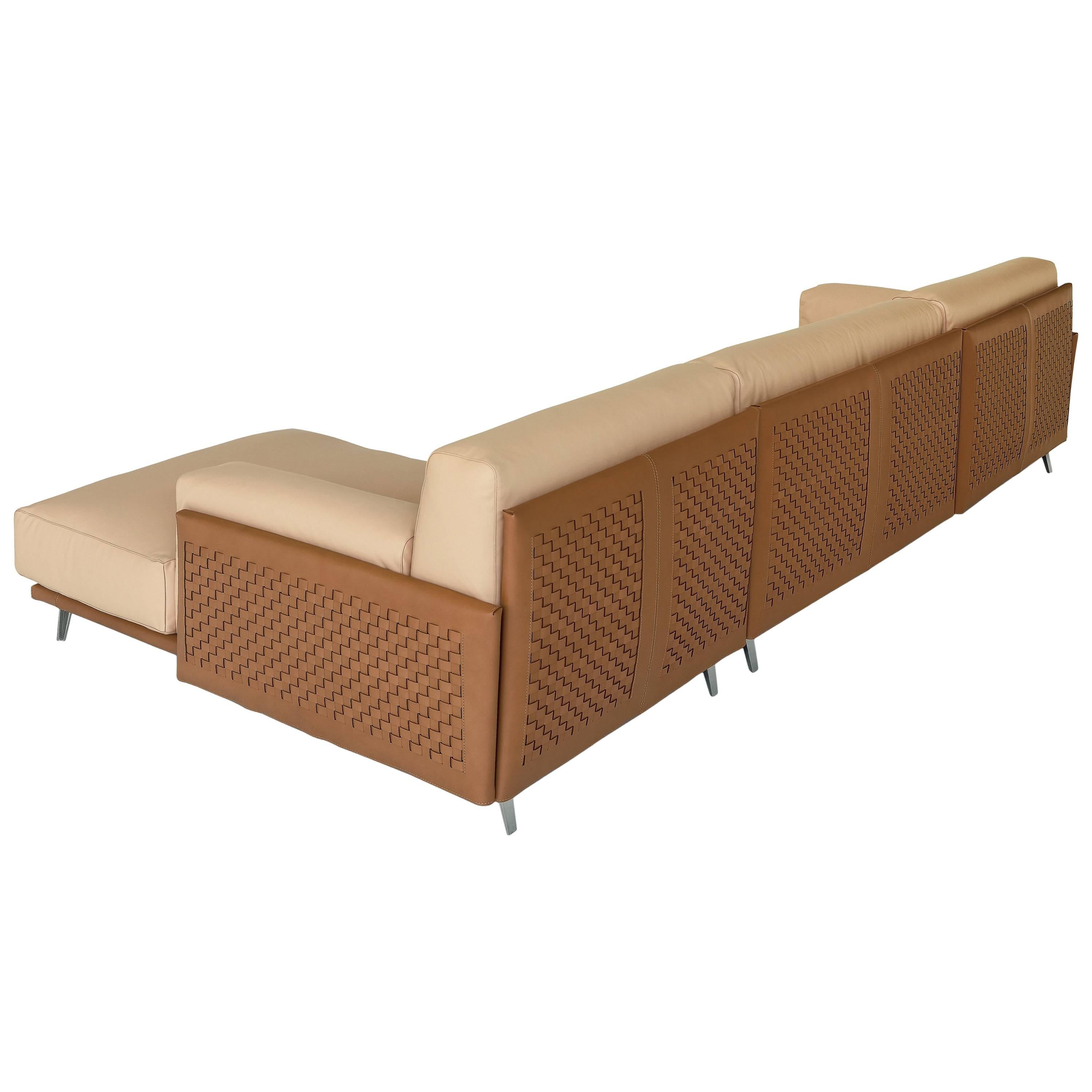 The seating system Frame has a comfortable line; its structure can be enriched by the manual interlacement of the cowhide, for giving to the sofa an elegant scene. Seat and back cushions in feather with polyurethane foam insert, for a soft and
