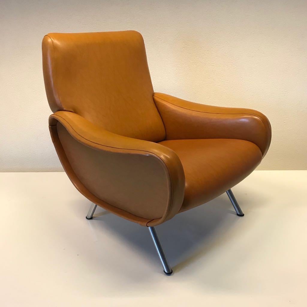 Two beautiful armchairs designed 1951 by Marco Zanuso for Arflex ,
The chairs have a lot of character and vintage look ,upholstered with conhaque sky upholstery still in good condition
 a definate eyecatchers.