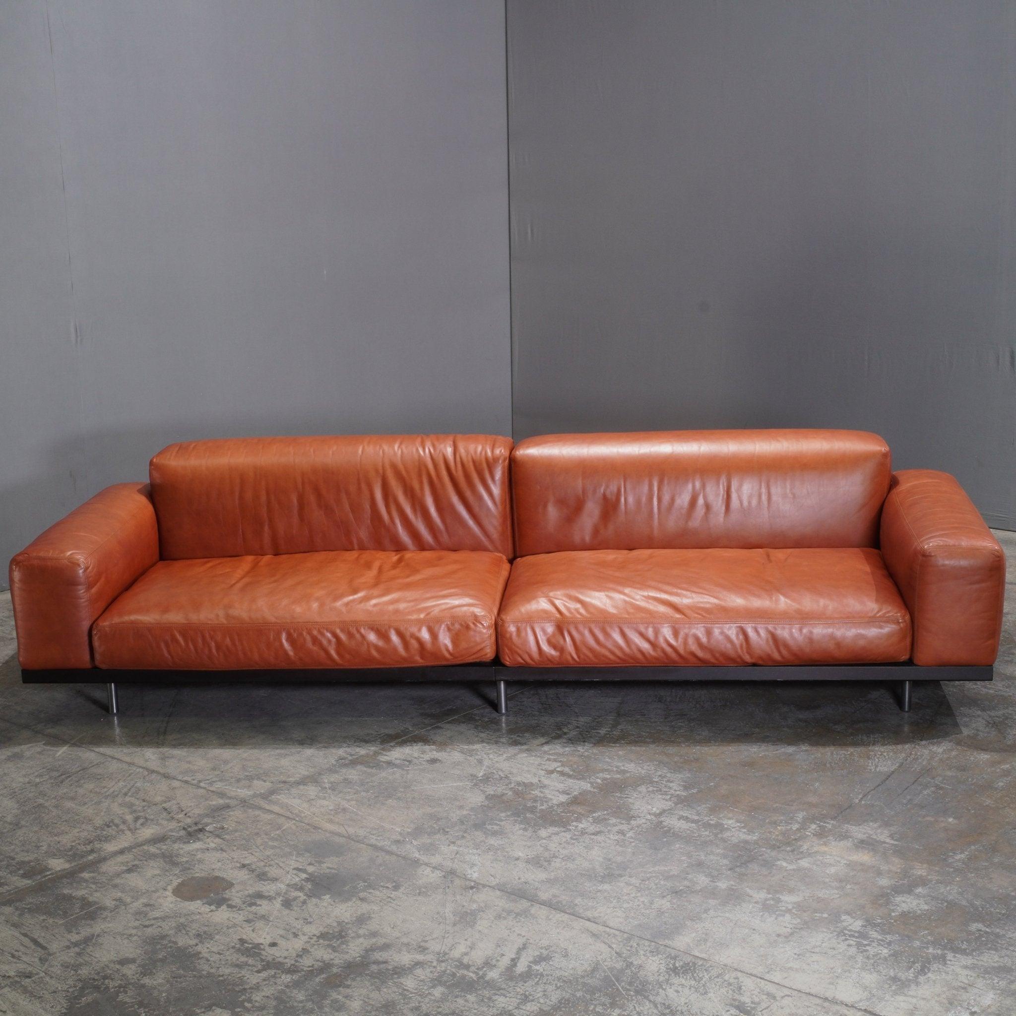 The Arflex Naviglio Sofa by Umberto Asnago is a stunning embodiment of contemporary elegance and refined craftsmanship. Its sleek, modern lines are complemented by soft, plush cushioning that invites relaxation. Upholstered in premium fabrics, the