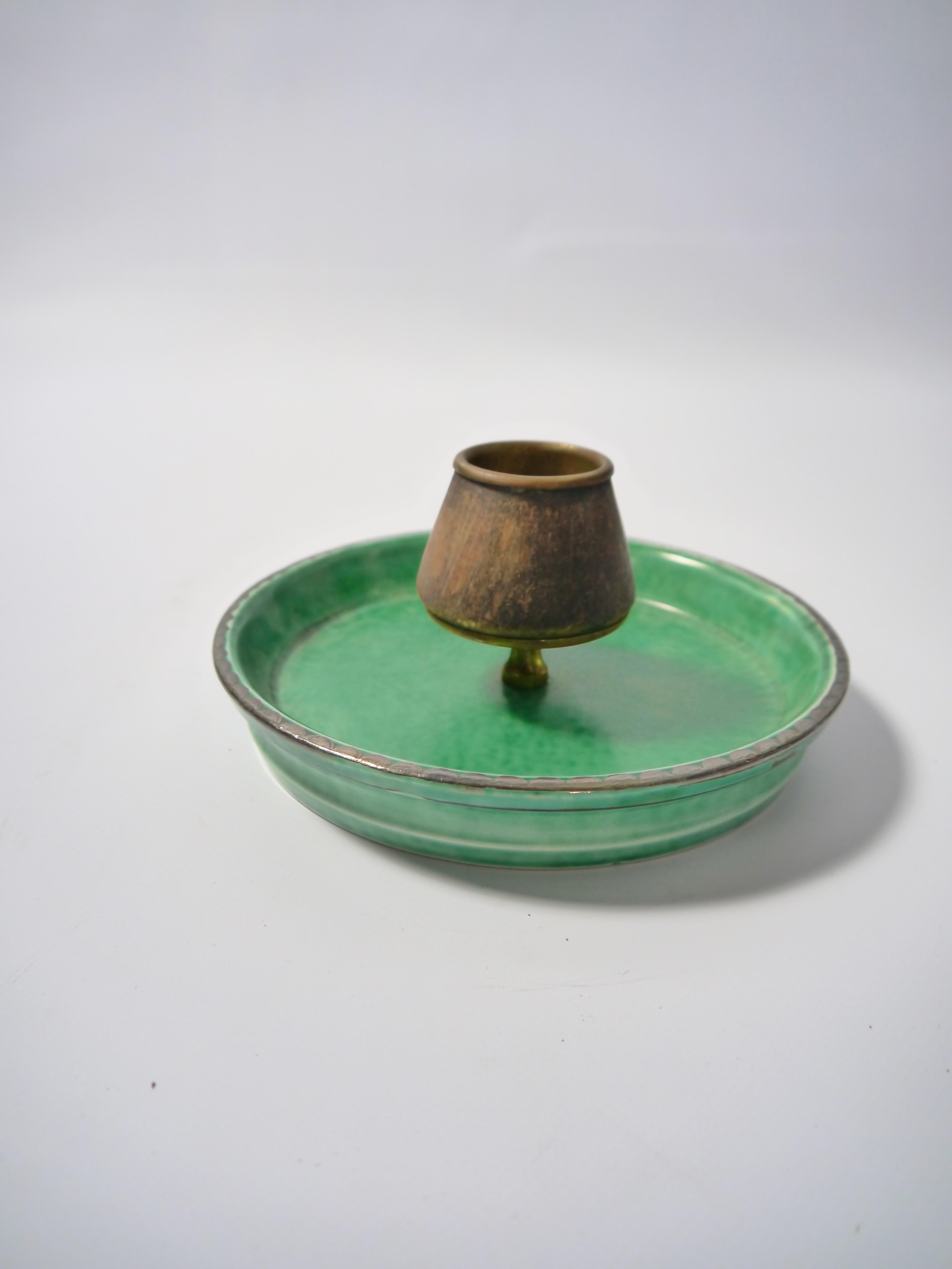 Green glazed ceramic ashtray with matchstick holder in copper covered in cork (brass fixings at the base), from the emblematic 