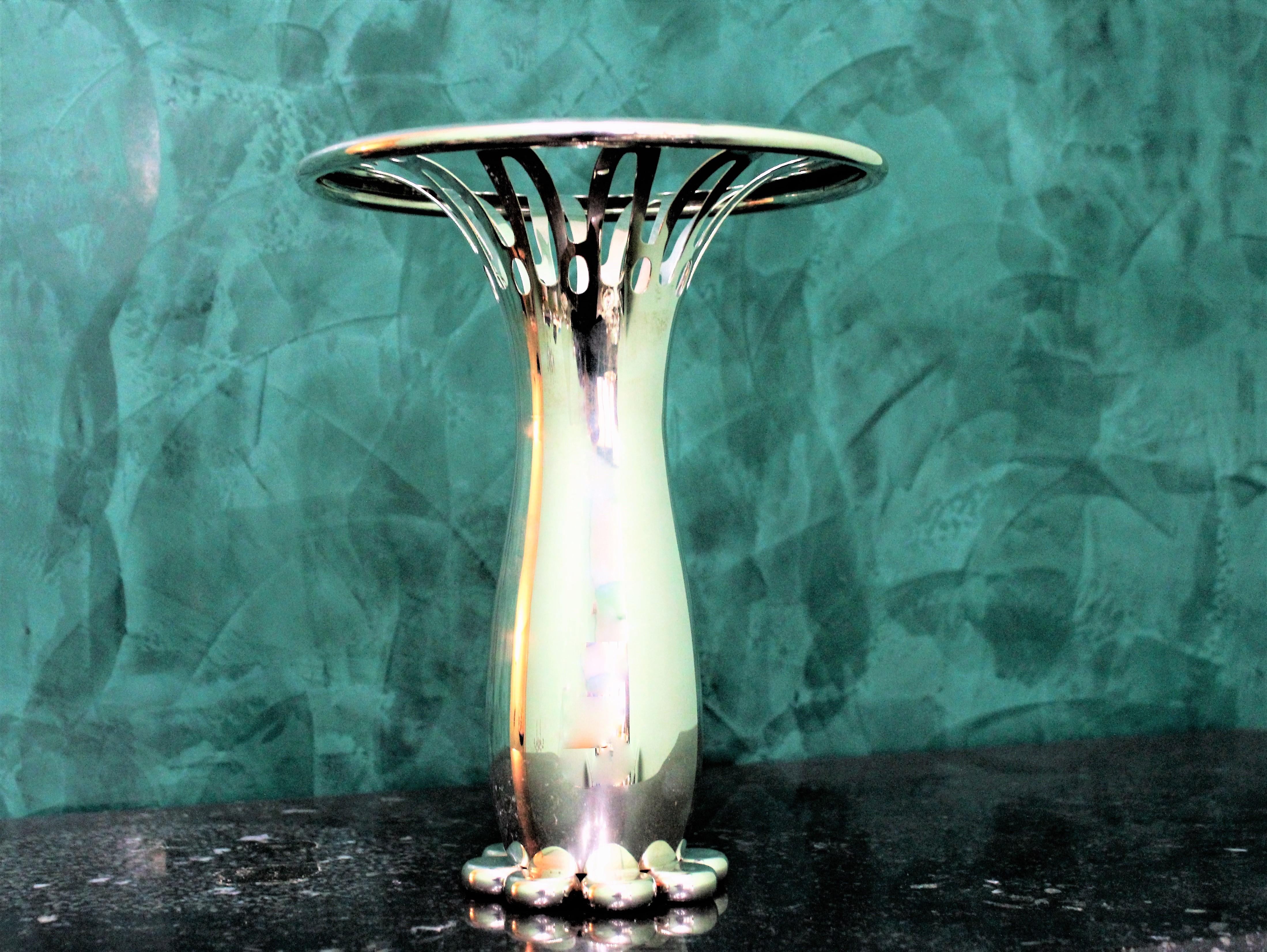 Handcrafted silver flower vase by Argenteria Pampaloni from Florence.
Very original design and magnificent work. Realized circa 1980s
Weight: 1.104gr. Measure: Height 23.5 cm, diameter 19.5 cm in the upper part
Modern and elegant flower vase