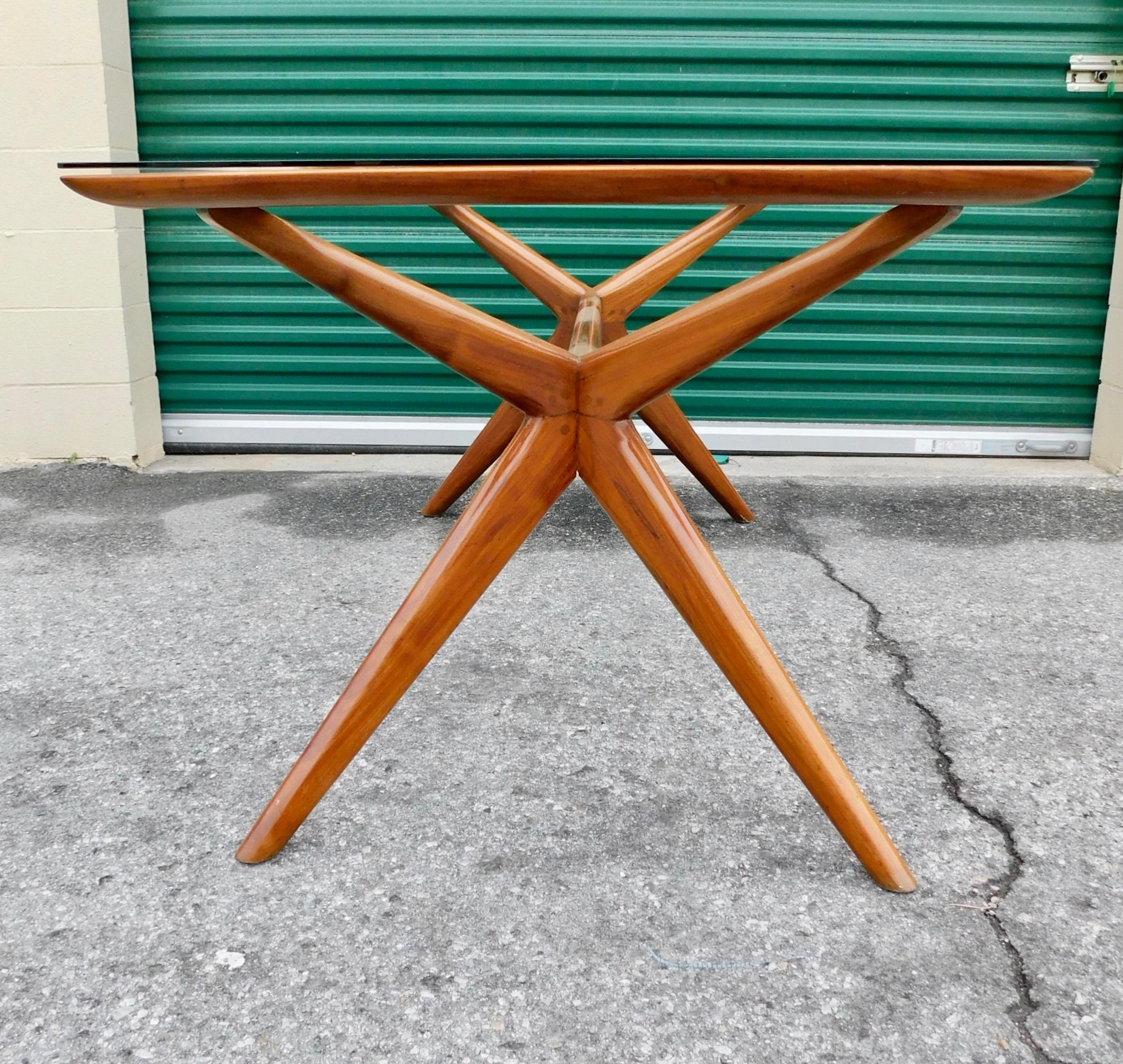 Argentine dining table rendered in petiribi wood.
Buenos Aires, circa 1960
Lightly restored and sold with newly fabricated tempered glass top.
In excellent condition-ready for a lifetime of good use.