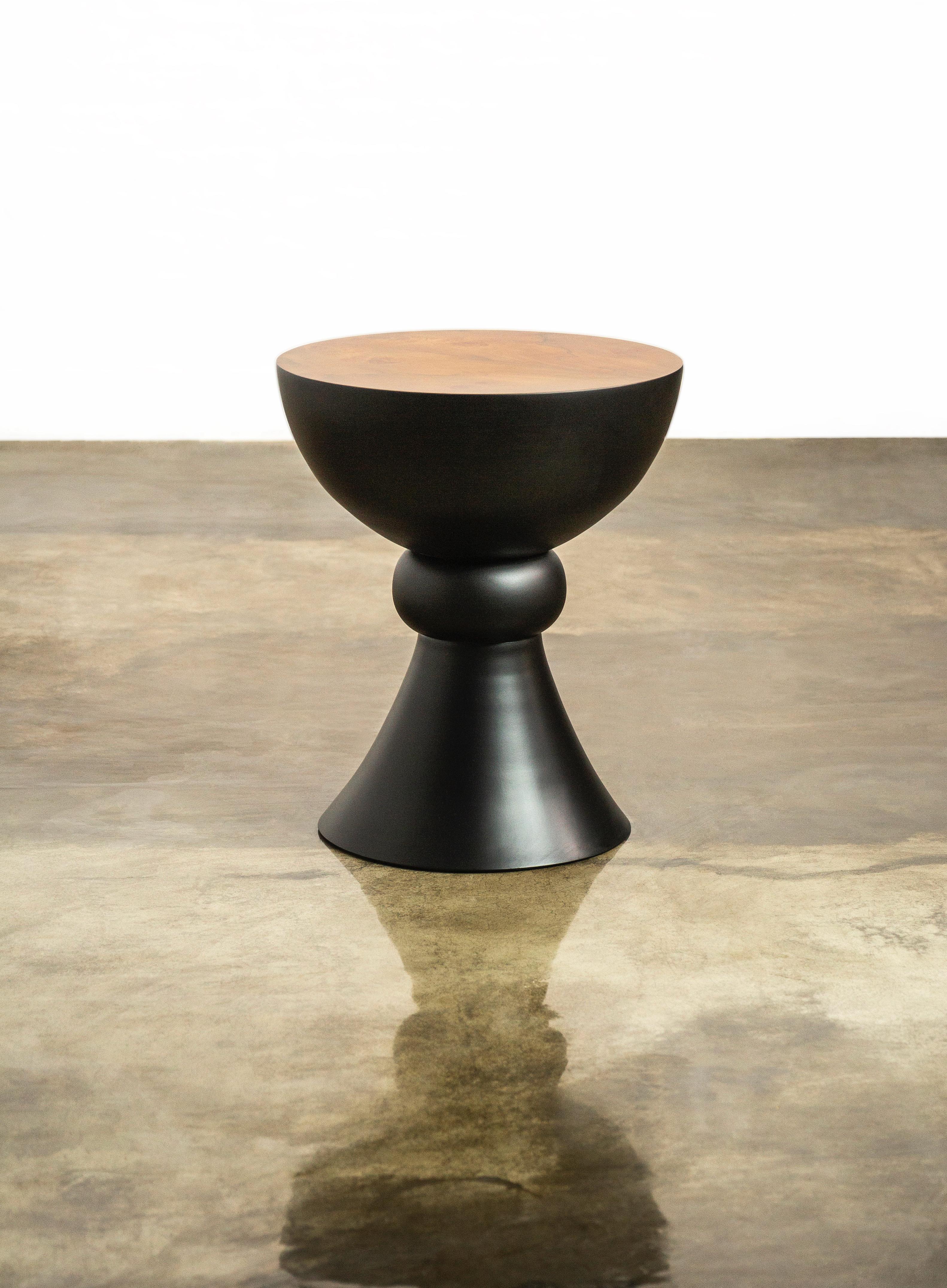Caliz: A Turned Sculptural Walnut Burl Occasional Side Table from Costantini Design 

Measurements are 18.5 diameter by 22.5 high.  

The Caliz occasional table, which can also function as seating, takes its name as well as its form from the Spanish