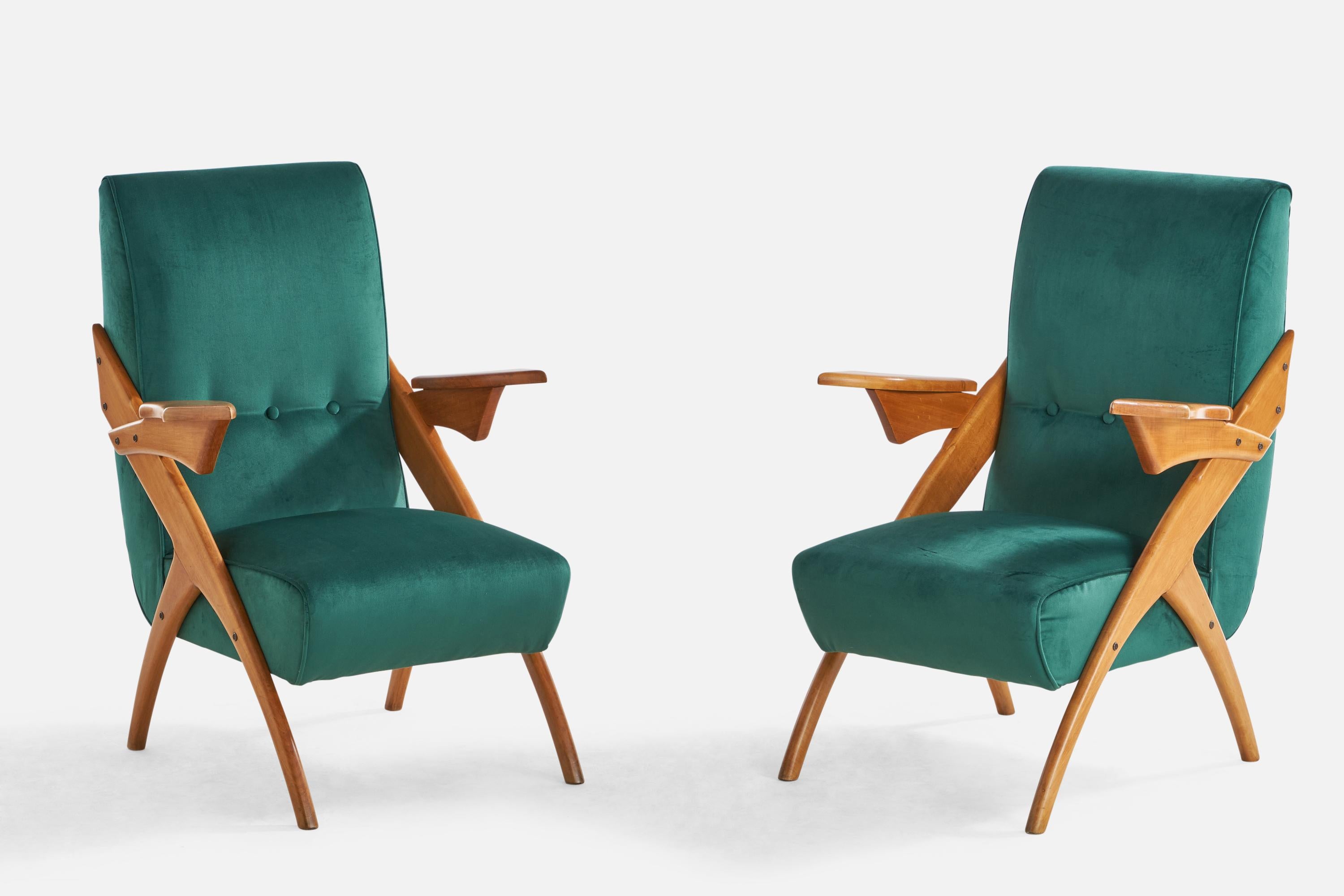 A pair of wood and blue velvet lounge chairs designed and produced in Argentina, 1950s.

Seat height: 15”
