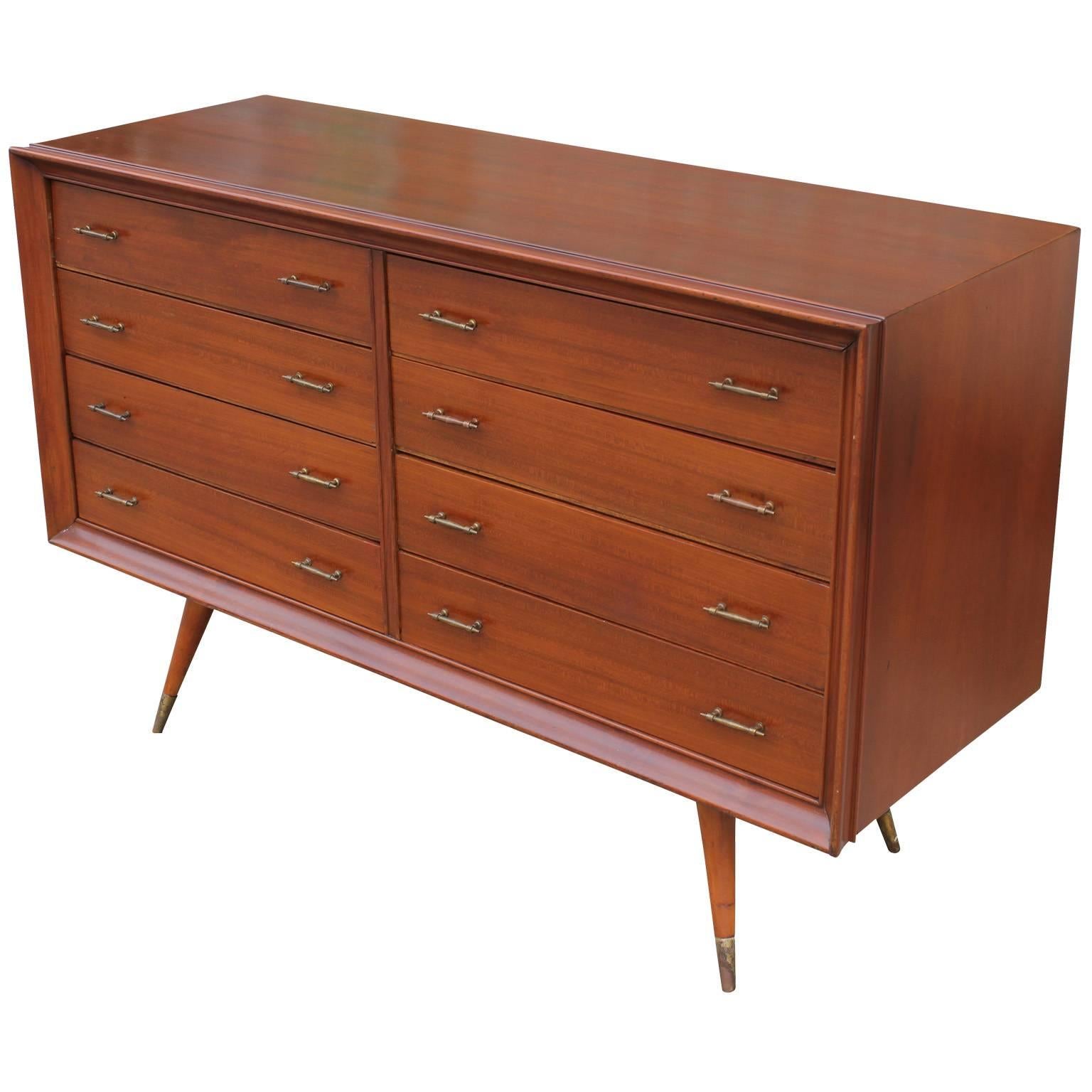 Beautiful Argentinian eight-drawer dresser. Dresser has a wonderful attention to detail-making this a great transitional piece. Tapered and splayed legs are capped in brass.