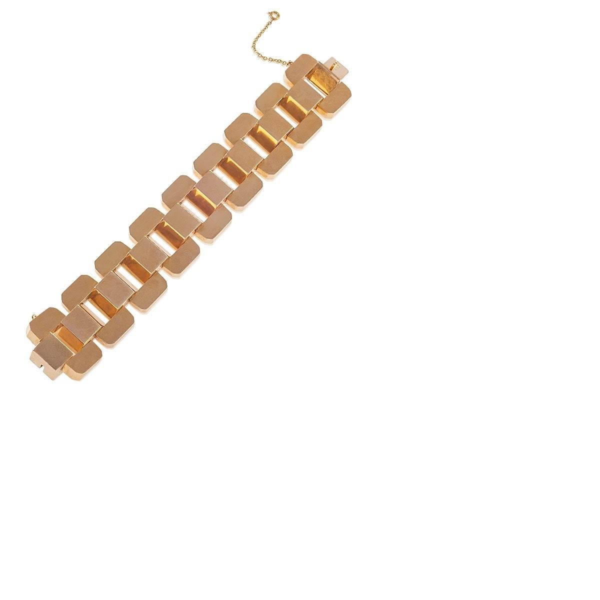 An Argentinian Retro 18 karat rose gold bracelet. The highly polished rose gold piece of substantial weight follows a single, elegant design of flattened vertically-oriented rectangular links, adjoined by gabled rectangular sub-links.  Argentina