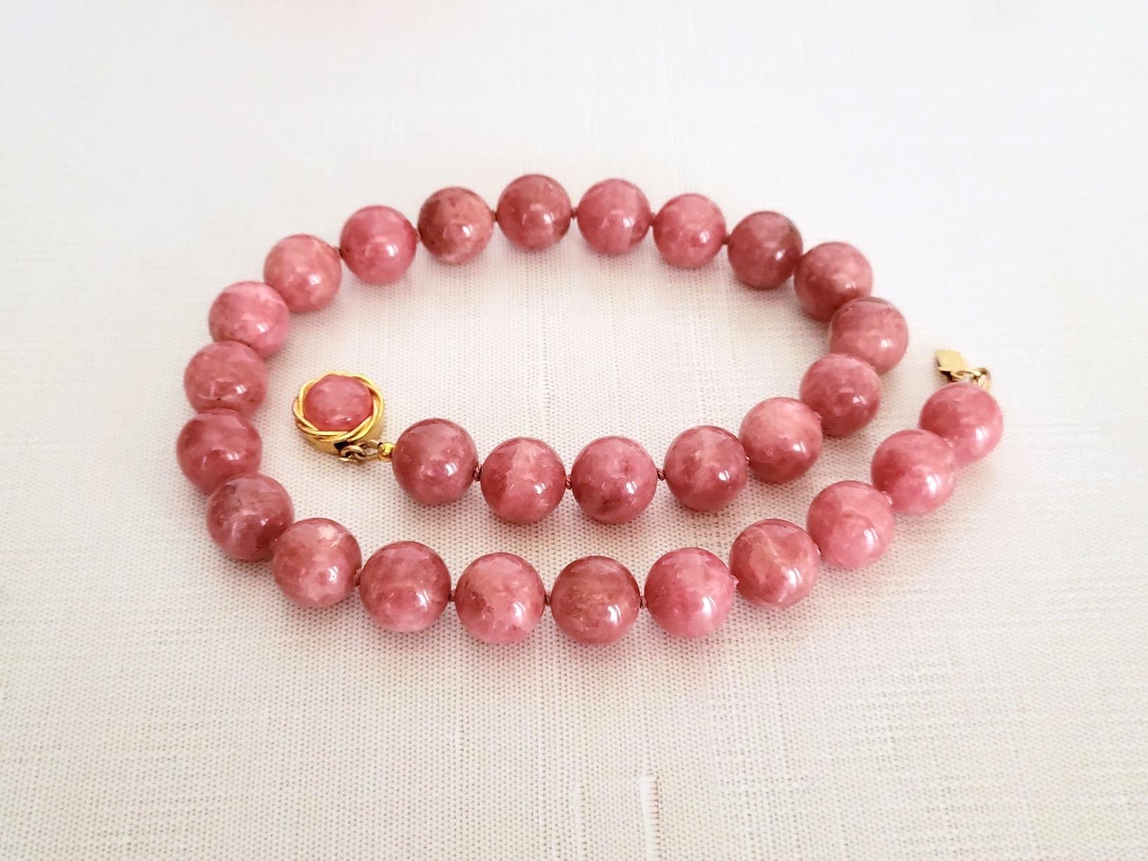 The necklace is 18 inches (45.7 cm) long. The rare size of the smooth round beads is 14.5-15mm.
Natural, lovely orangy red rhodochrosite, delicious strawberry jam color. Authentic, natural color not treated in any way. 
The necklace is fastened with