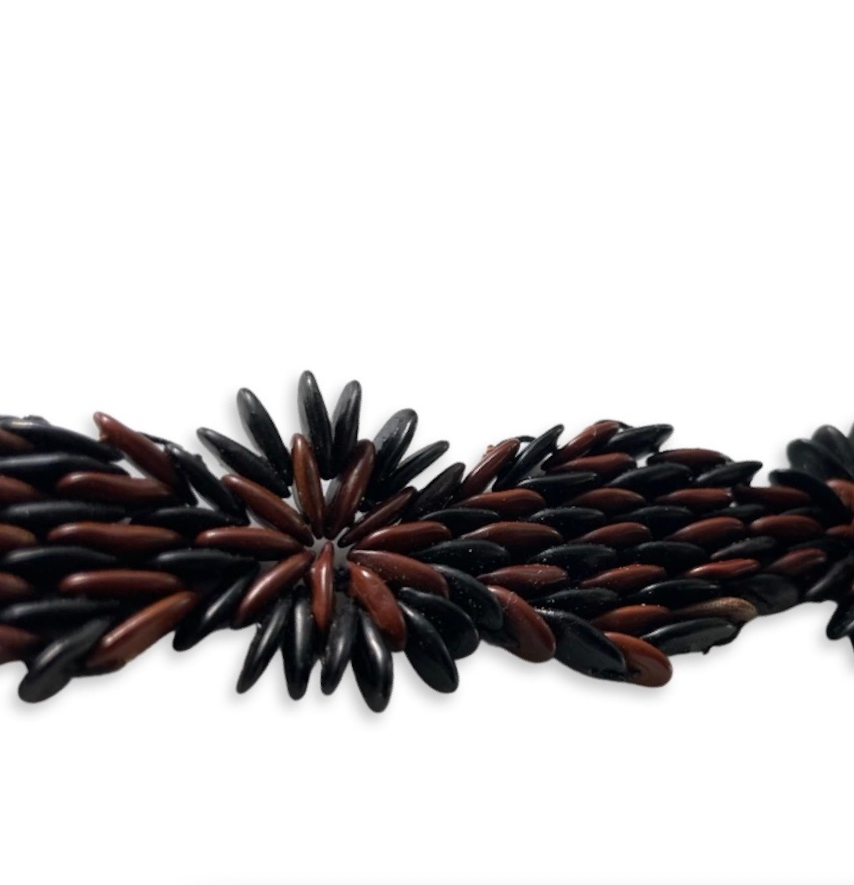 The designs express the perfect synergy between Black and Brown wild tamarind seeds when combined in a dazzling palette. Aptly named an ode to Antigua’s vibrant culture around sailing, the “Argo” Bracelet pays tribute to a ship that sails under the