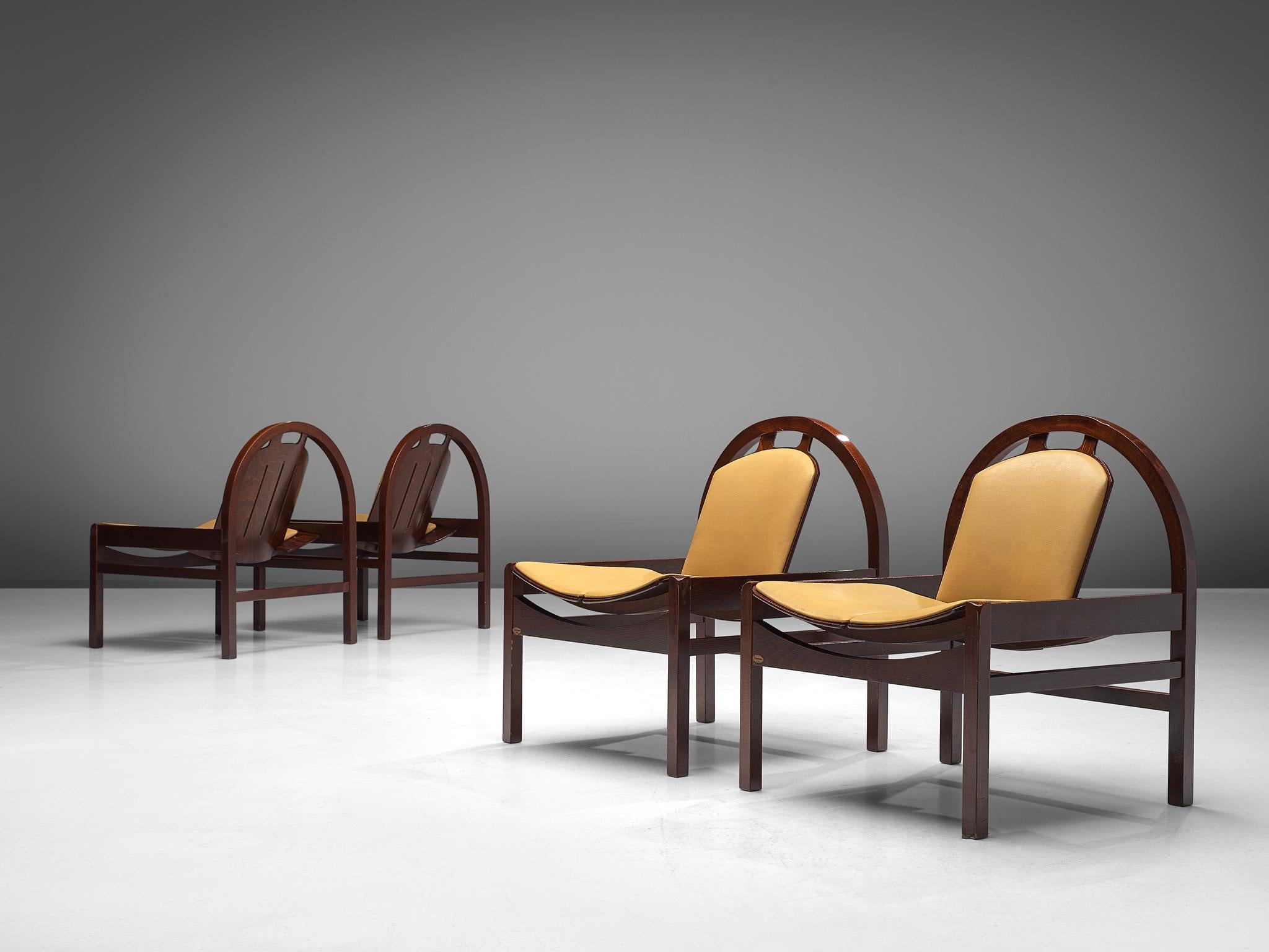 Baumann, set of four 'Argos' easy chairs, beech and leather, France, 1970s

These Argos lounge chairs are manufactured by Baumann in France. The chairs feature a rounded frame that supports the tilted backrest. The tilted seat is wide and low and