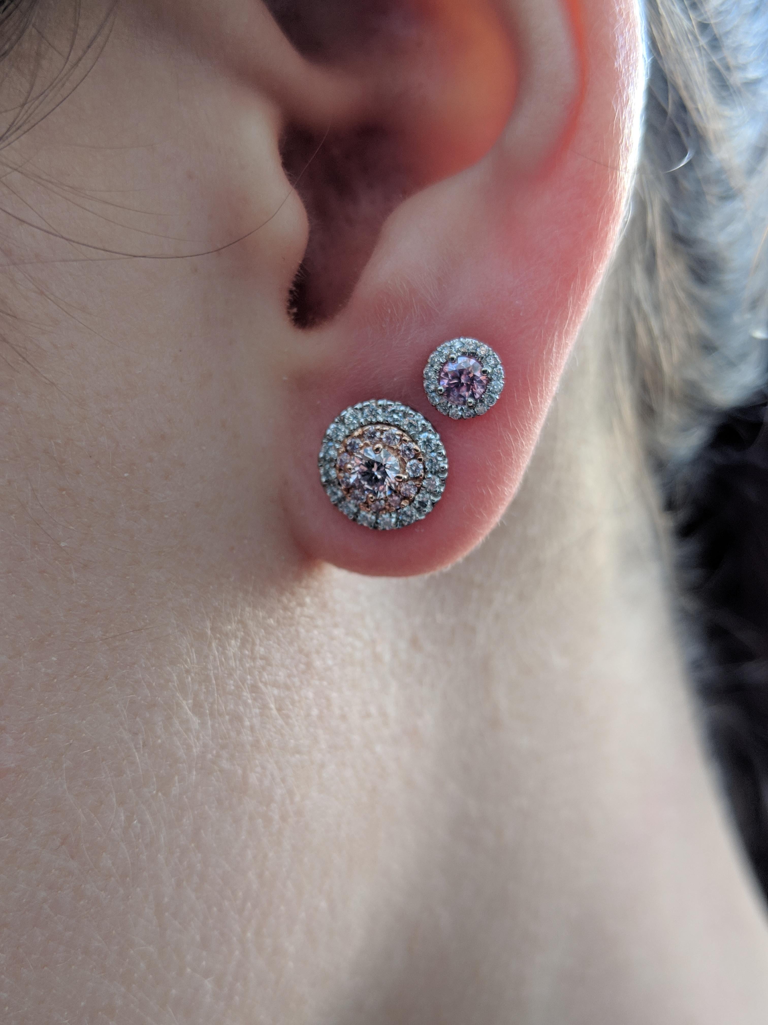 Hand Made 18k rose and white gold earrings set with 2 argyle pink diamonds in the center. Argyle Cert numbers are 403861 and 403787. Accented by .38 argyle pink and white melee. The argyle mine ended its production in November of 2020. Marking the