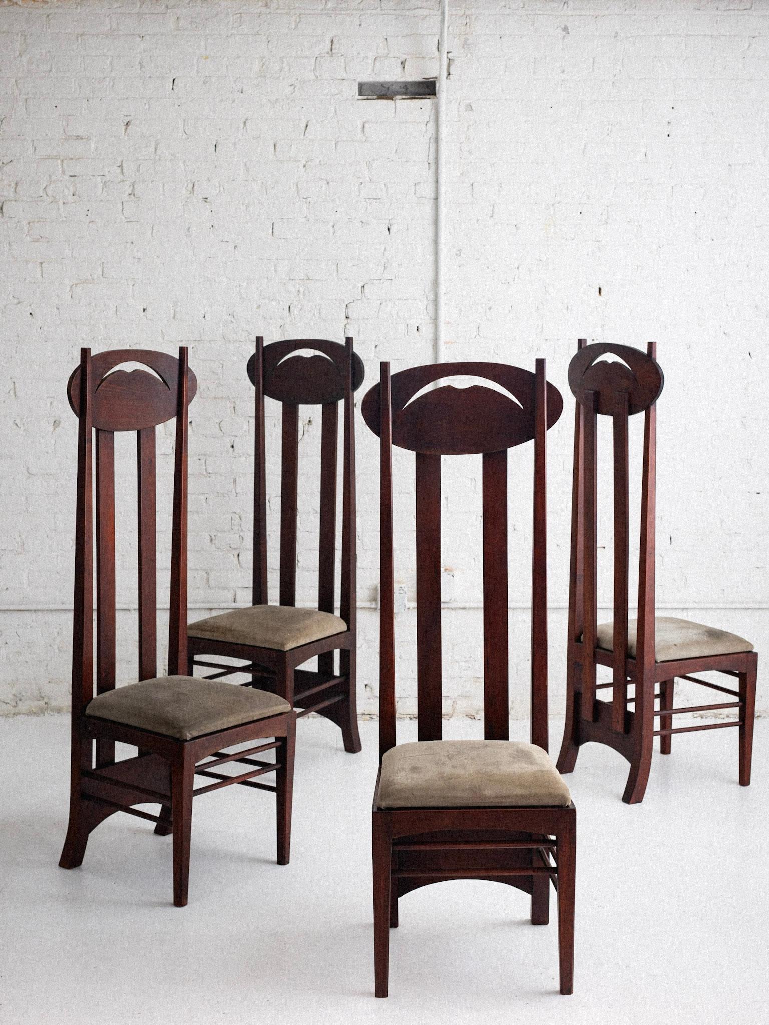 A set of 4 “Argyle” chairs in the style of Charles Rennie Mackintosh. Designed in 1897 for the Luncheon Room of the Argyle Street Tea Rooms in Glasgow. This set features dark stained wood with suede seats. Seats are unattached and simply rest on the