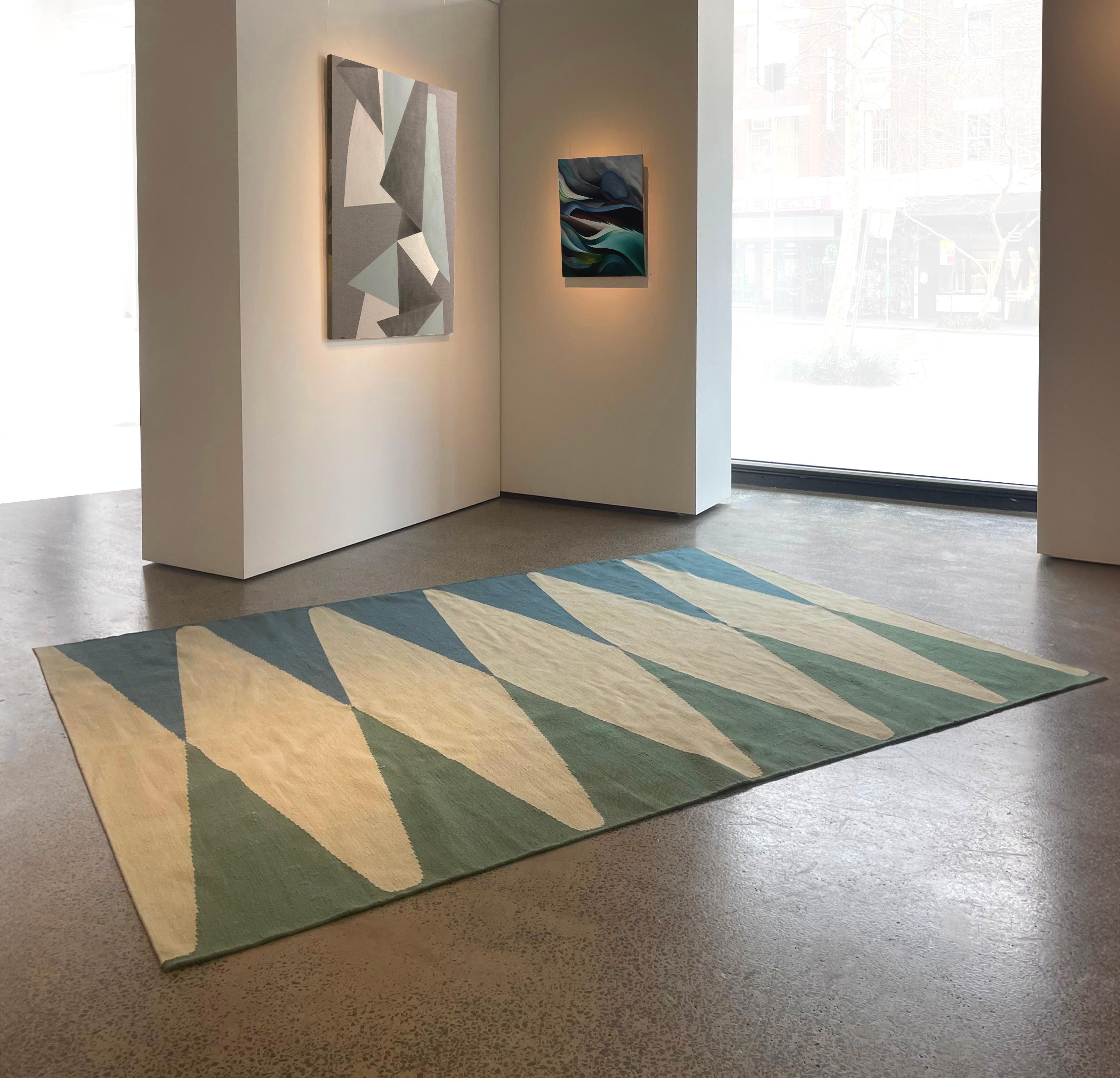 Argyle Kilm by Wende Reid is a minimal three colour graphic inspired by early 20th century British Art Deco motifs. 
Each Argyle Kilm is made to order in any colour palette and size.
It's clean defined pattern is a perfect vehicle for colour.
It's