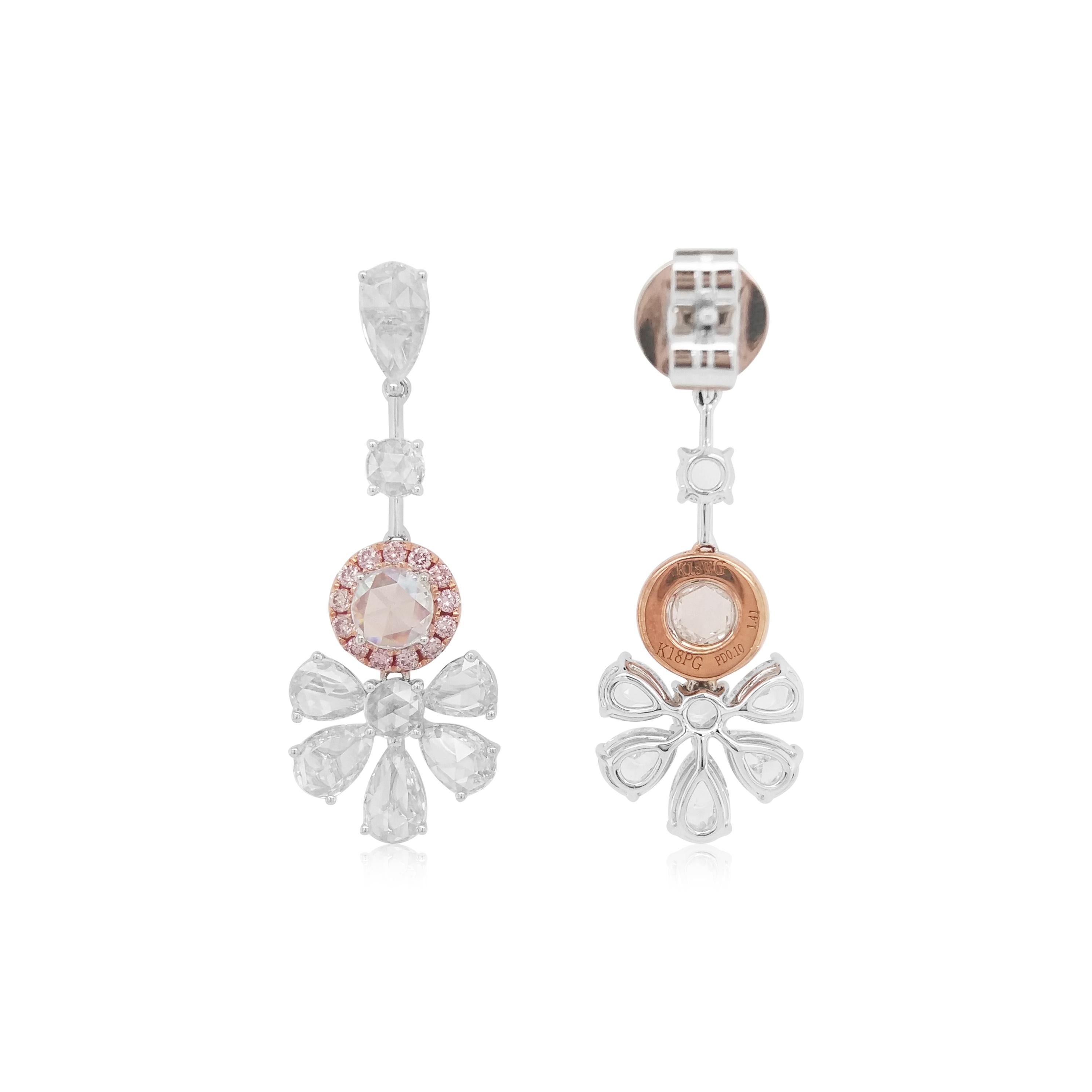 These alluring earrings feature spectacular pear and round shape rose cut white diamonds and a halo of scintillating arrangement of Argyle pink diamonds. Perfectly showcasing the mesmeric beauty of rose cut white diamonds, these one-of-a-kind