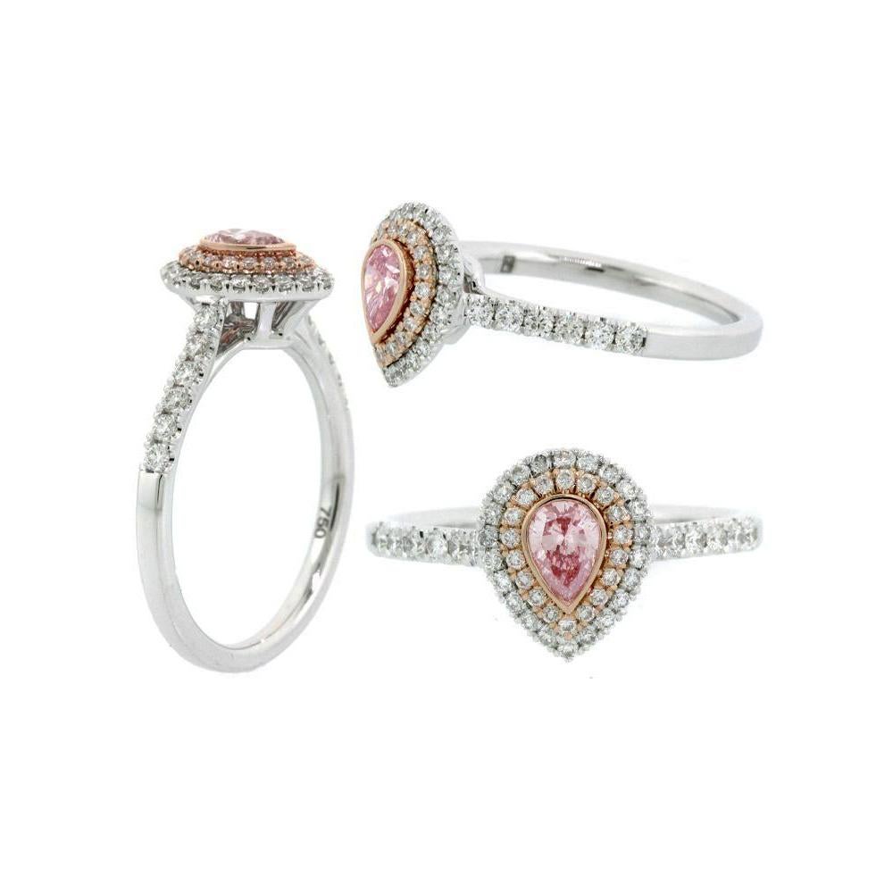 Argyle Pinker Diamantring in Birnenform
0.22 Karat in 18k Weiß- und Roségold Pavé-Ring
pavé-Diamanten 0,38 Karat Gesamtgewicht
6.5 Ringgröße