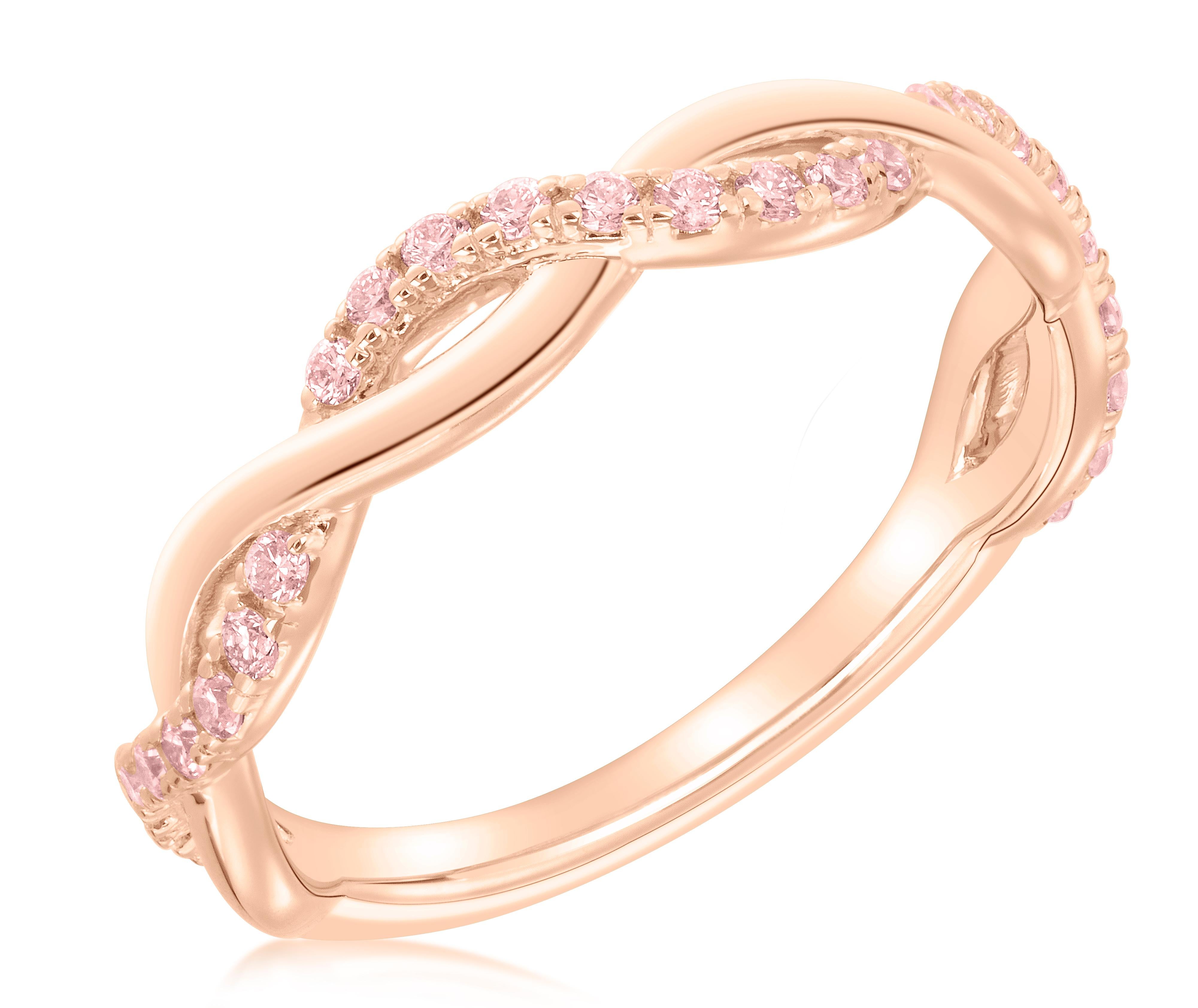 Add some sparkle and rarity to your finger with this stunning stackable twist band featuring 27 natural argyle pink diamonds weighing .27 carats. The band is set in 14k rose gold and is sized at 6.5, but can be adjusted to your finger size. These
