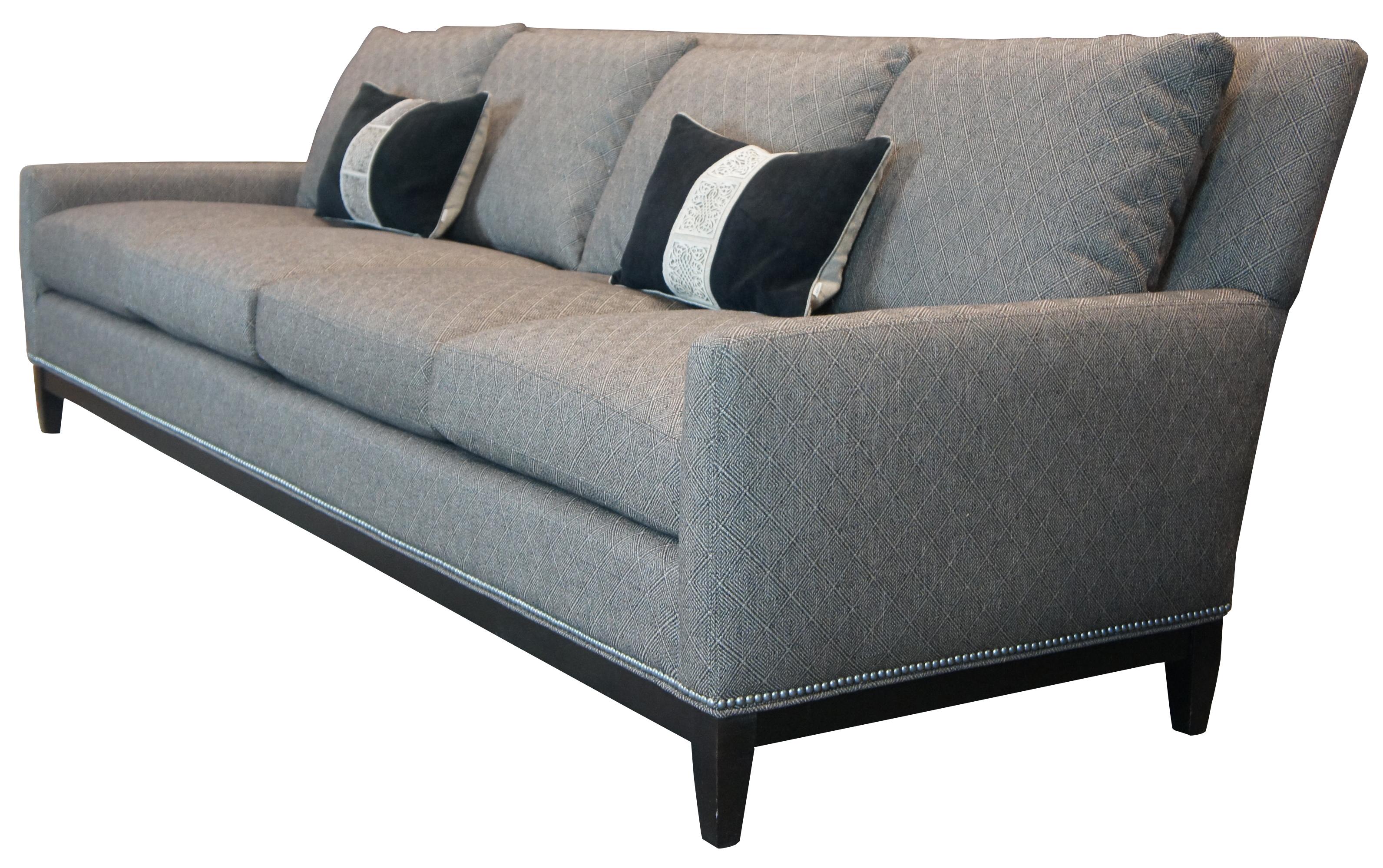 Arhaus Furniture Camden Collection four seat sofa or couch. Features Arhaus's Bench Crafted Upholstery, a gray tweed style fabric with a geometric repeating pattern, accented with nailhead trim and tapered feet. Measure: 100
