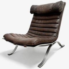 ARI fauteuil acier et cuir par Arne Norell
