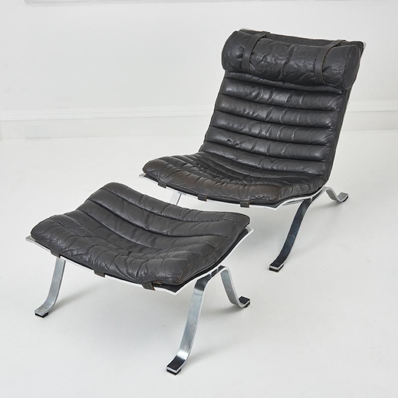 This Original Arne Norell “ARI” Lounge Chair with Matching Ottoman, crafted in the 1970s, is a true design classic that embodies the epitome of mid-century Scandinavian elegance. 

Designed in 1966, the “Ari” was awarded “Showpiece of the Year” in