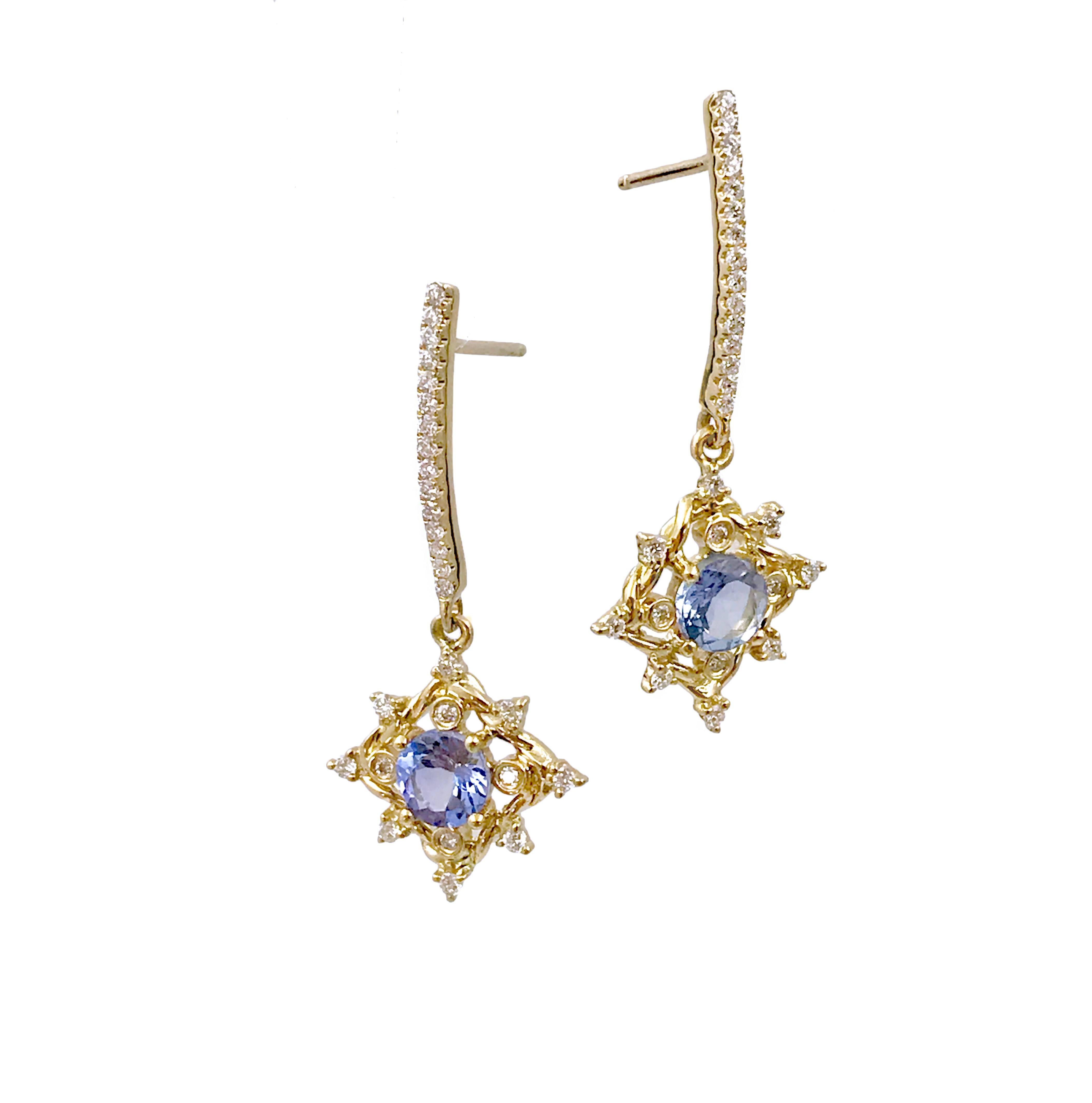 Ari Tanzanite drop post earrings in 14K Yellow Gold with 0.336TCW Diamonds, and it's in stock and ready to ship.

JeweLyrie's signature twist forged to a diamond shape to frame a 5mm round tanzanite  with small bezel and prong set white diamonds
