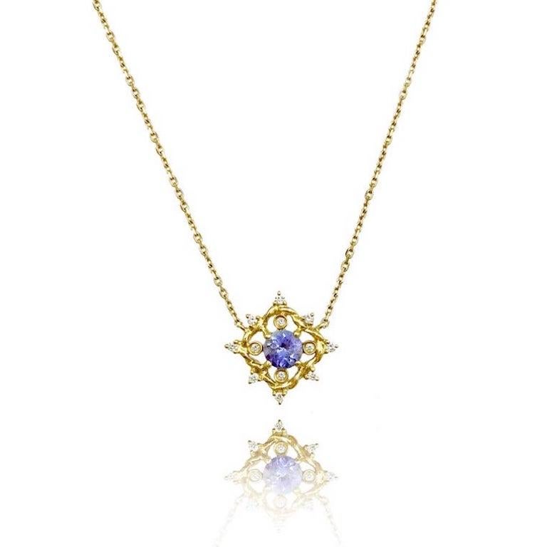 This listing is for Ari Tanzanite Petite Pendant Necklace in 14K Yellow Gold with 0.10TCW Diamonds, Made-to-order

JeweLyrie's signature twist forged to a diamond shape to frame a 0.56ct, 5mm round tanzanite with small bezel and prong set white