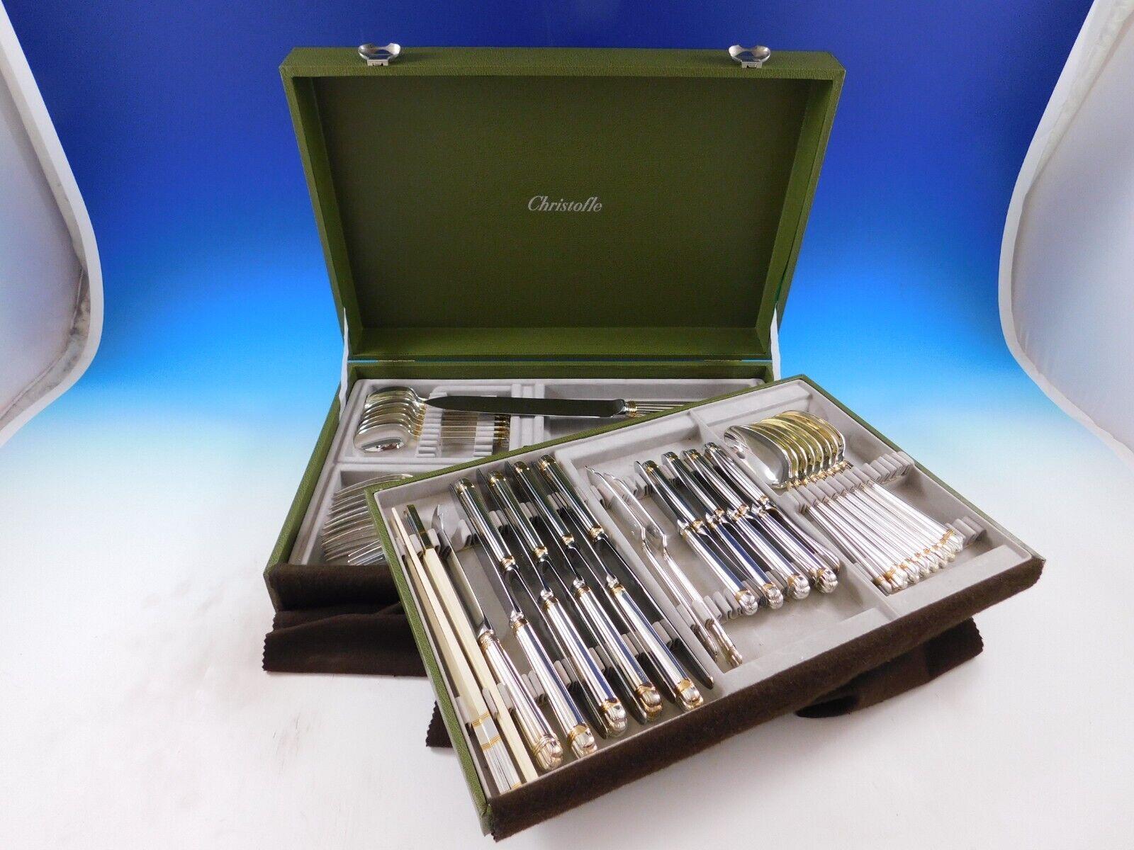 Dinner size Aria gold by Christofle France silverplate flatware set - 64 pieces. This set includes:

8 dinner size knives, 9 5/8