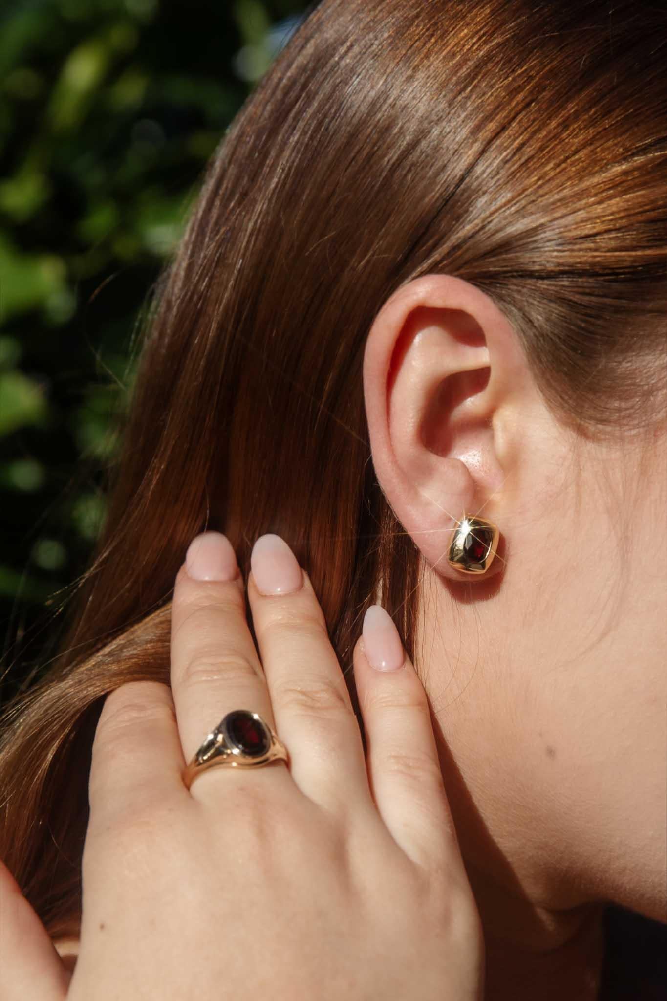 Crafted in 14 carat gold, our Aria Ring is a gorgeous jewel, lifted on beautifully engraved shoulders, her oval crimson garnet sits with a regal bearing. She is bold and assured ideal for the strong woman in your life.

The Aria Ring Gem Details
The