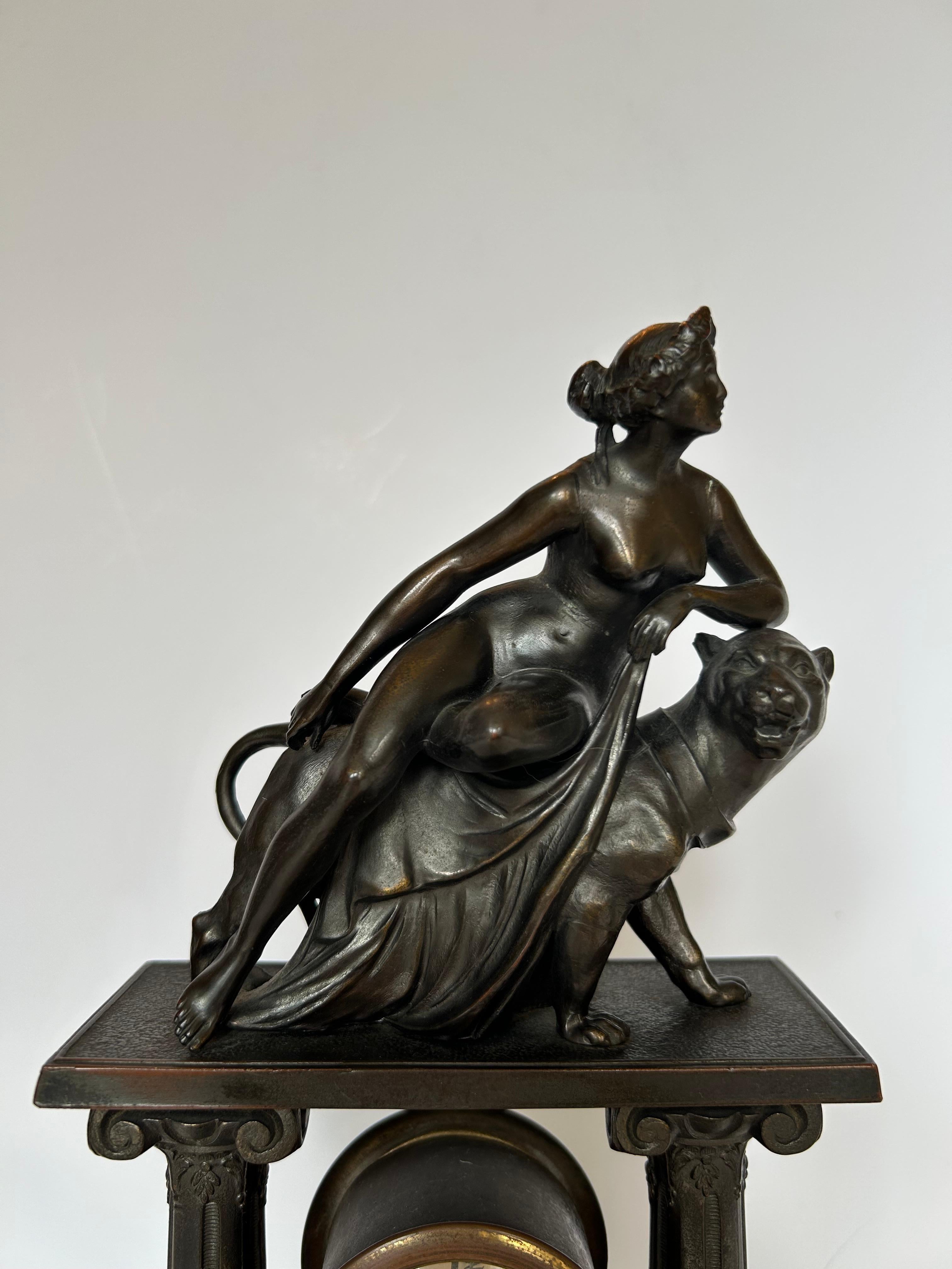 A lovely, solid bronze mantel clock depicting Ariadne and the Panther, after the famous sculpture by Johann Heinrich Dannecker (1758-1841). Here the princess Ariadne, wife of Dionysius, sits gracefully on a panther as she holds a swath of drapery in