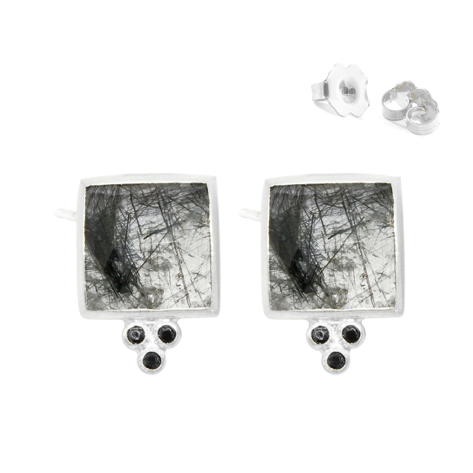 Square dance: Designed with hand-faceted tourmalated black quartz framed in a textured silver, the Ariana Silver Studs go with everything in your closet.
Nina Nguyen Design's patent-pending earrings have an element on the back of the stud or charm