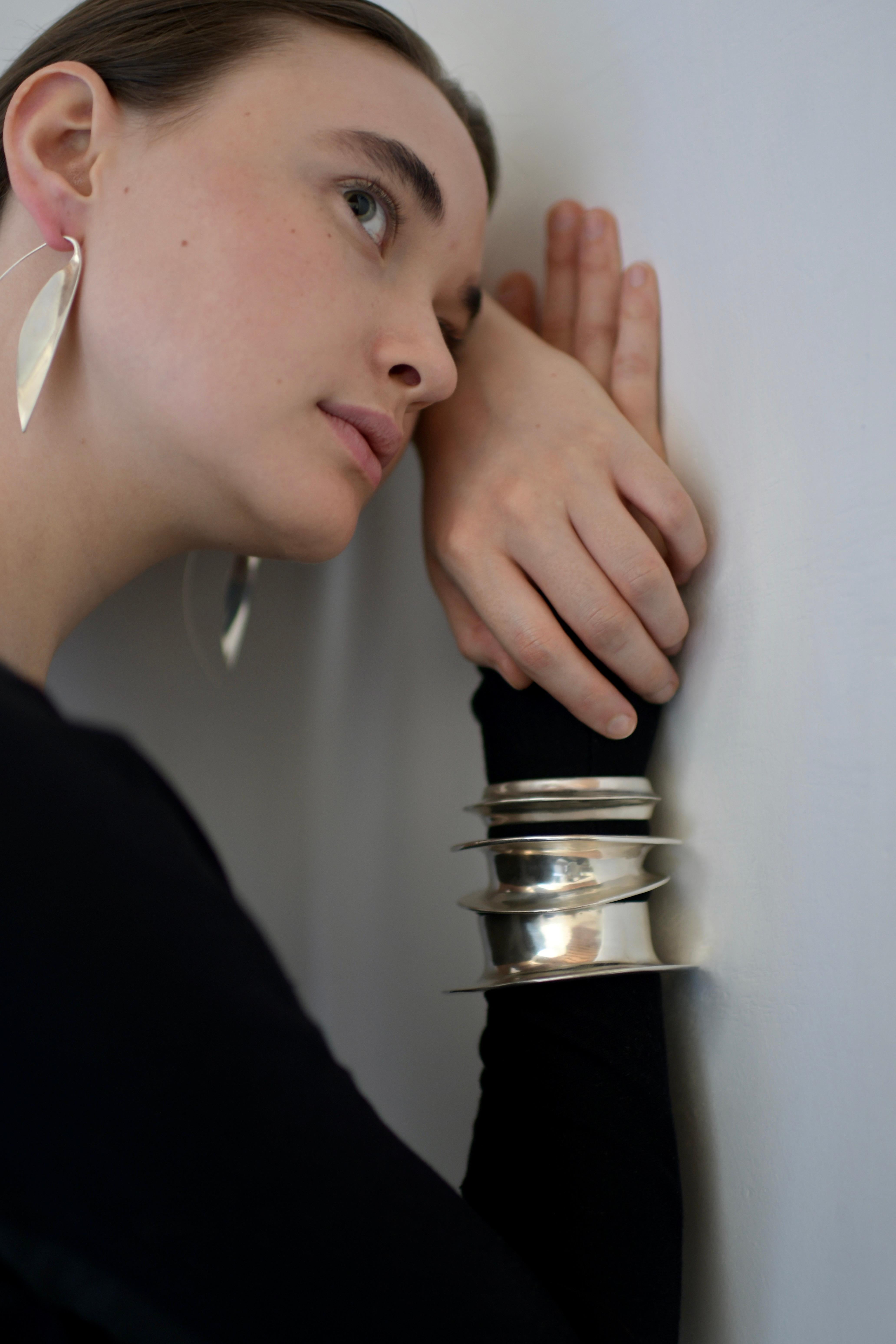 Ariana Boussard-Reifel's Bast Cuff is an ode to sculptural modernism. The soft twin walls create a reflective light in a deep metallic valley. Inspired by ancient Egypt, the Bast easily glides on and sits comfortably all day, any day. You'll find