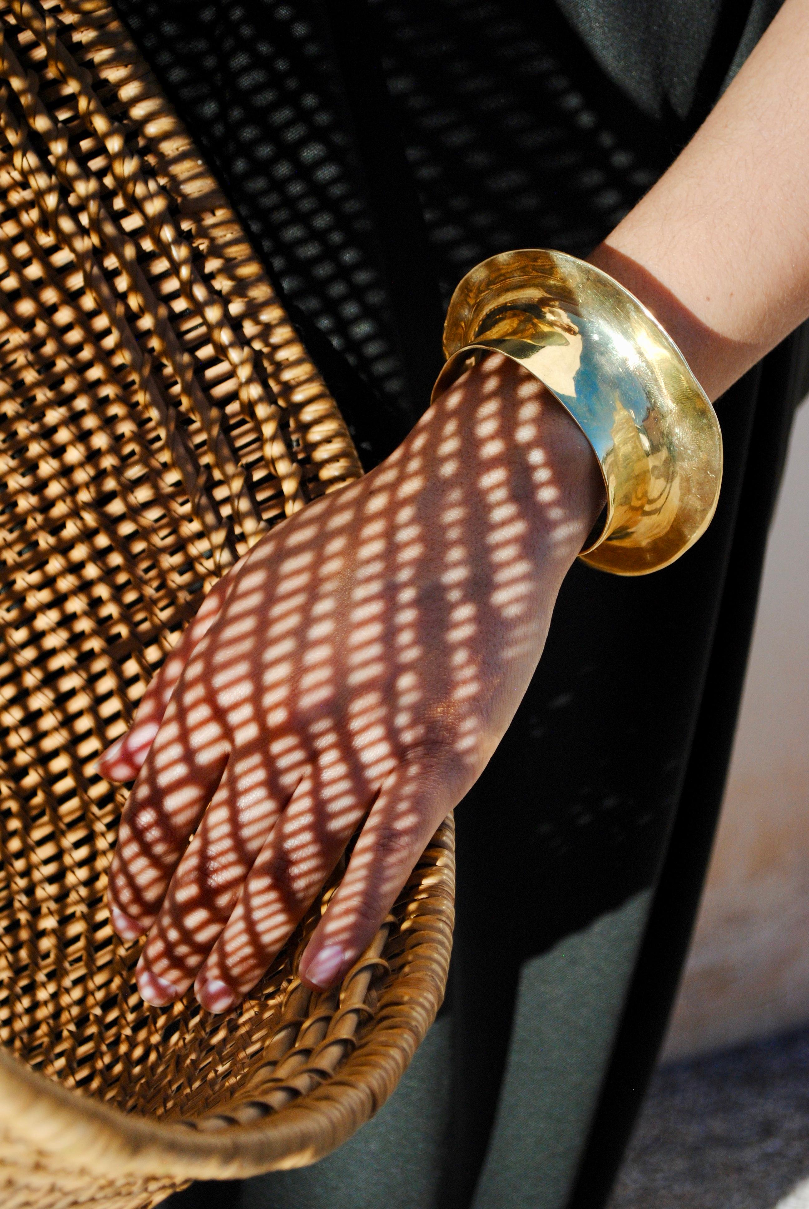 Our Despina cuff has become the signature piece of our collection. The first piece of jewelry Ariana carved from a block of wax before there was even a collection. It was inspired by Mayan Gold from the Met Museum in New York. It represents a strong