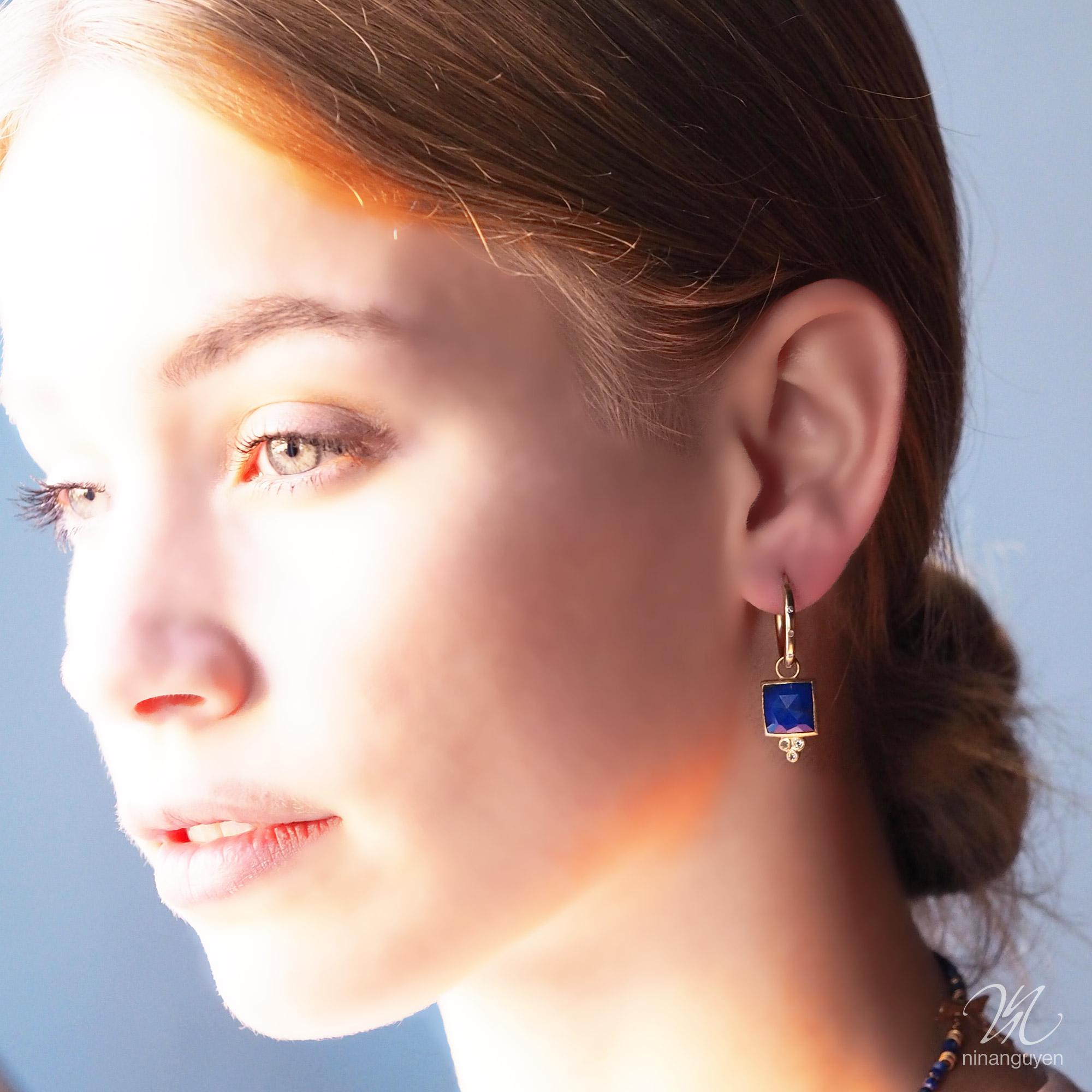 Square dance: Designed with hand-faceted lapis framed in a textured gold, our diamond-accented Ariana.

Stone carat: 8.5
Diamond carat: 0.35
Stone size: 10mm
Hoop size: 18mm

About the stones:
Lapis
A gemstone prized for its intense blue color since