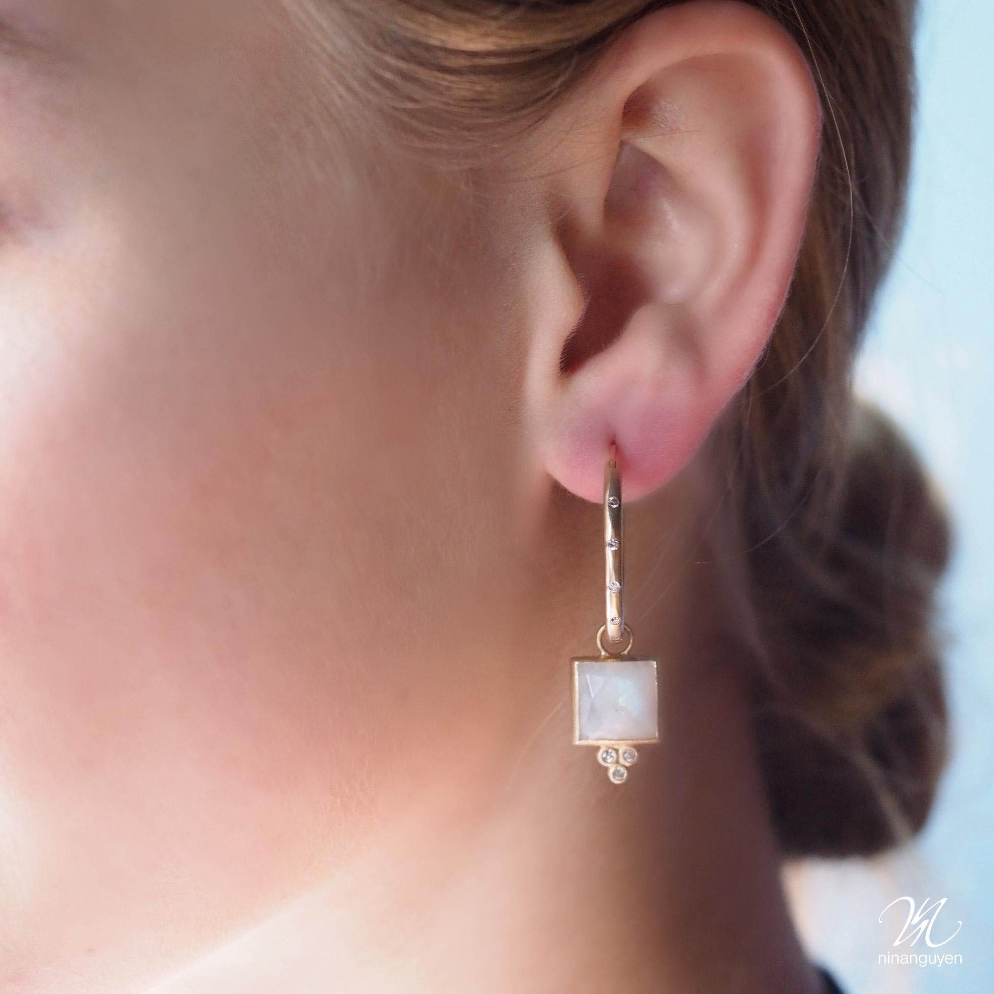 Square dance: Designed with hand-faceted moonstone framed in a textured gold, our diamond-accented Ariana Gold Charms pair with any of our hoops and mix well with other styles.

Nina Nguyen Design's patent-pending earrings have an element on the