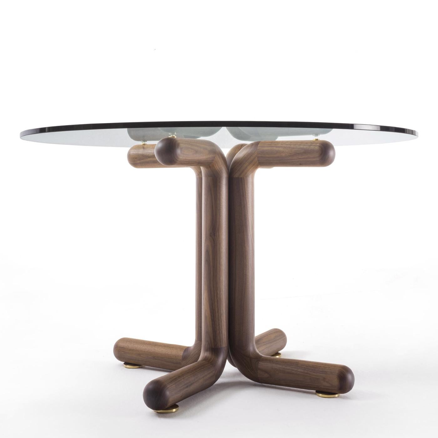 Table Ariana Walnut Round with solid walnut base and with 
clear tempered glass top, 12mm thickness. With brushed brass 
feet under the base. 
Also available on request in:
Diameter 150xH75cm, price: 7900,00€.
Diameter 140xH75cm, price: