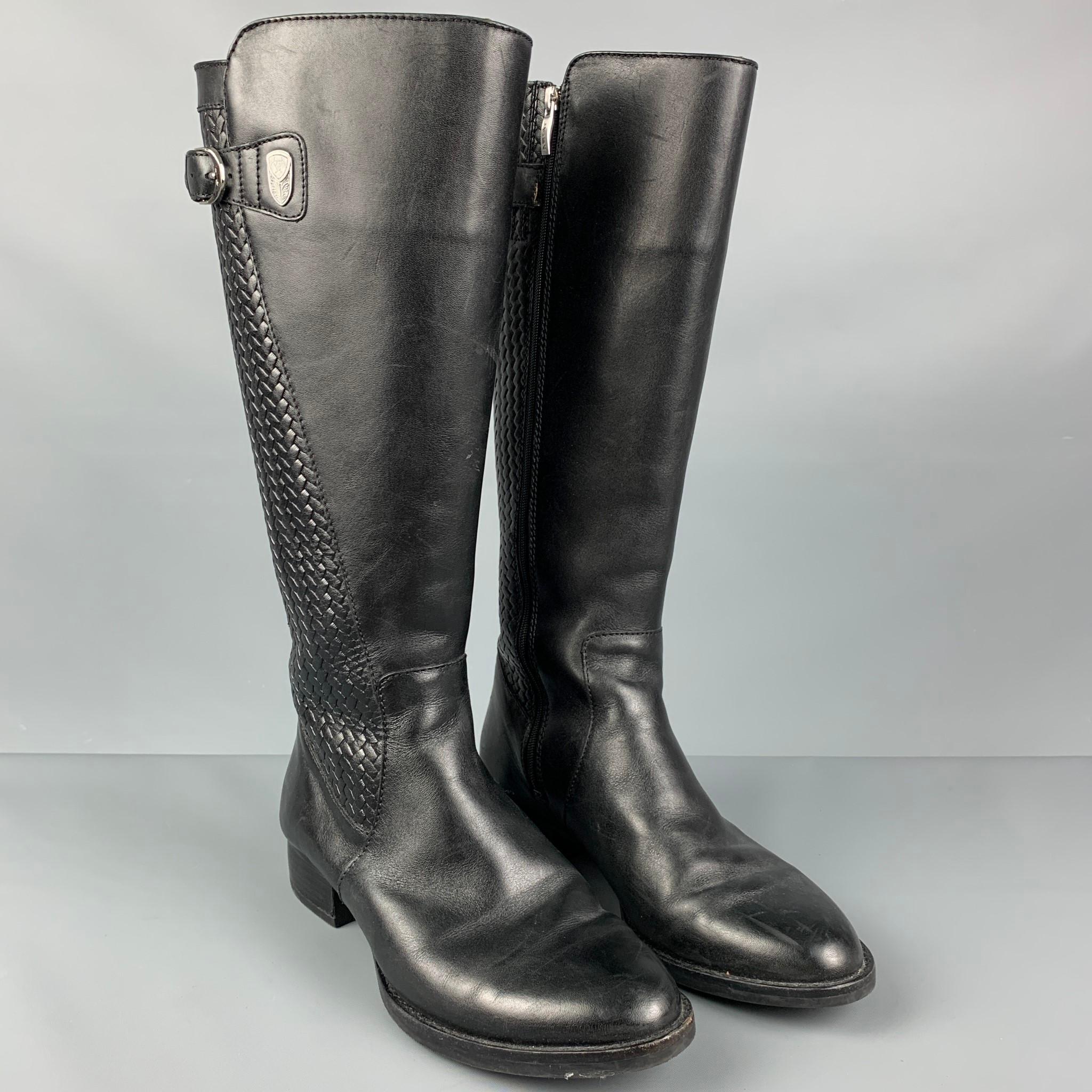 ARIAT boots comes in a black leather featuring a woven panel, buckle detail, and a side zipper closure. 

Very Good Pre-Owned Condition.
Marked: 7.5

Measurements:

Length: 10.5 in.
Width: 3.5 in.
Height: 15 in. 