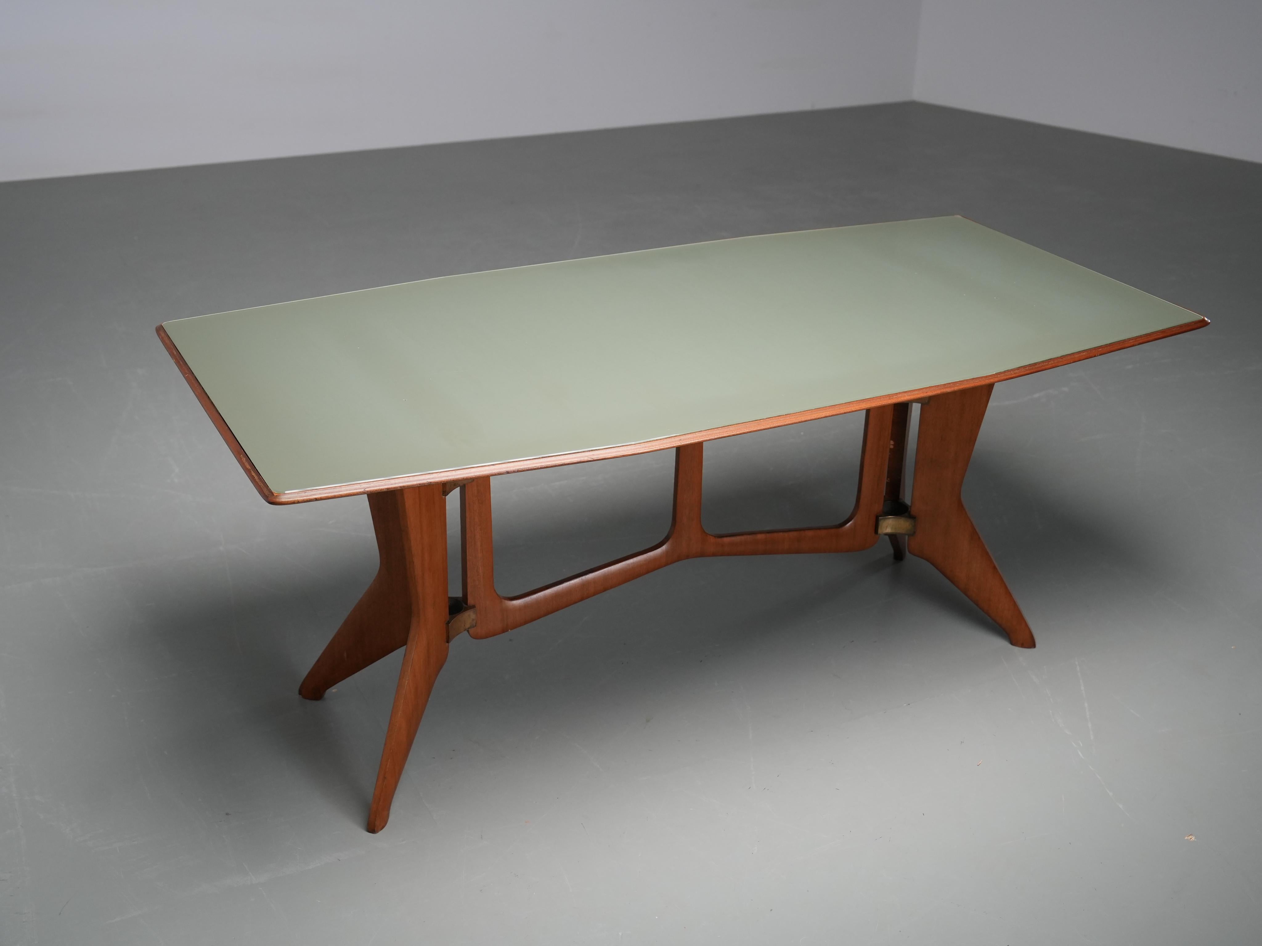 Ariberto Colombo Dining Room Table in Walnut, Glass and Brass

Rare 1950s Italian dining table with sculptural base in walnut and brass, a striking example of postwar Italian craftsmanship. The table stands out for the strong architectural quality