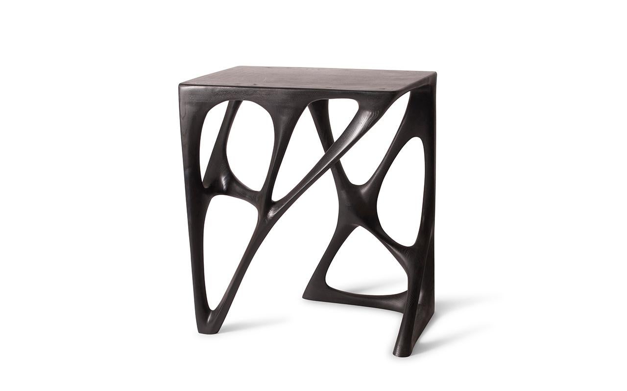 Ariel bar table carved from Ash wood in Ebony stain. it is available in different finishes and custom dimensions. 

About Amorph: 
Amorph is a design and manufacturing company based in Los Angeles, California. We take pride in hand crafted designs