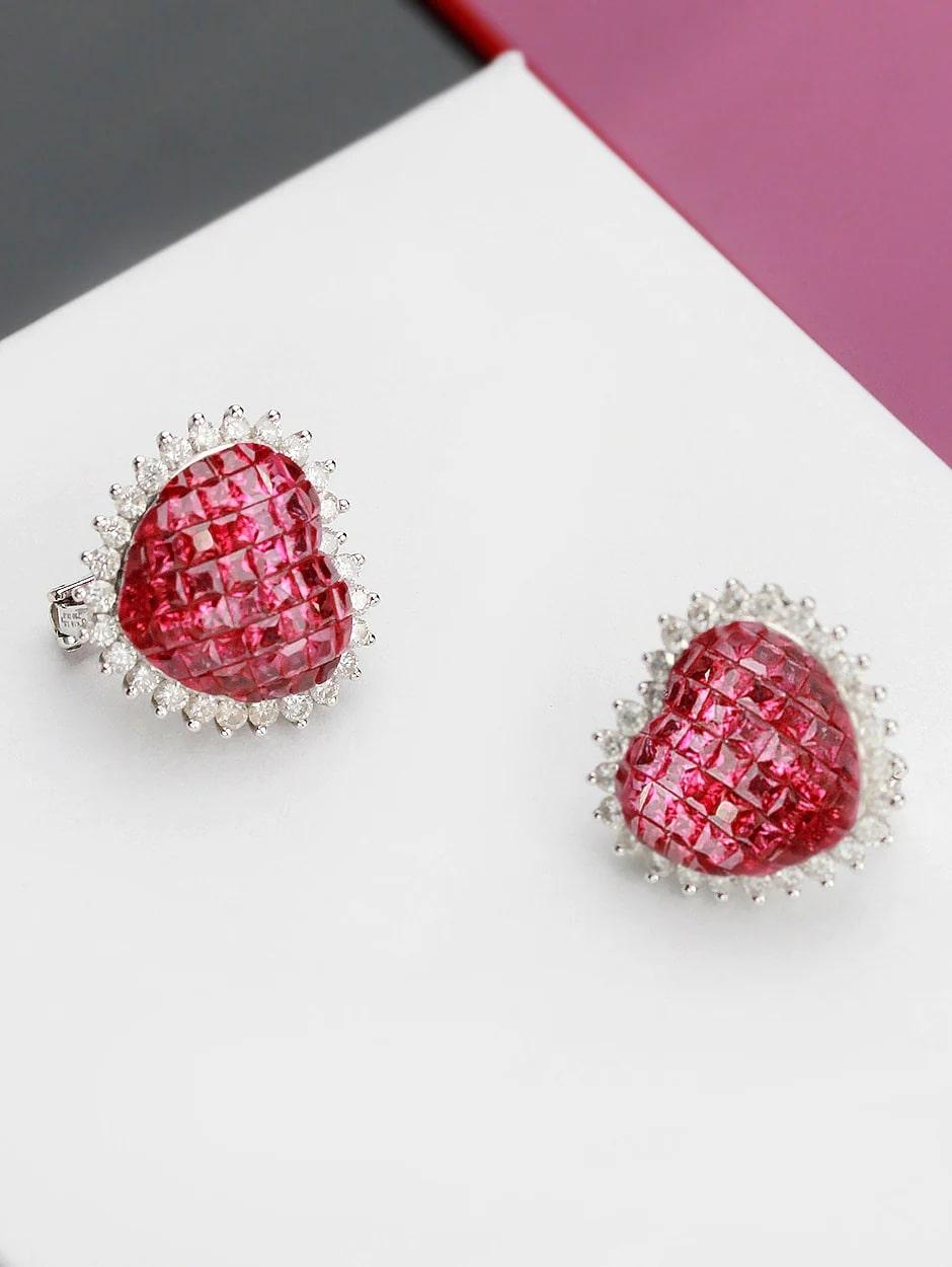 Inspired by the fire power of Aries, these invisible set earrings are made of stones cut and set perfectly into each other. The prongs setting the rubies are perfectly invisible! All finished with a high polish.

Earring Information
Diamond Type :