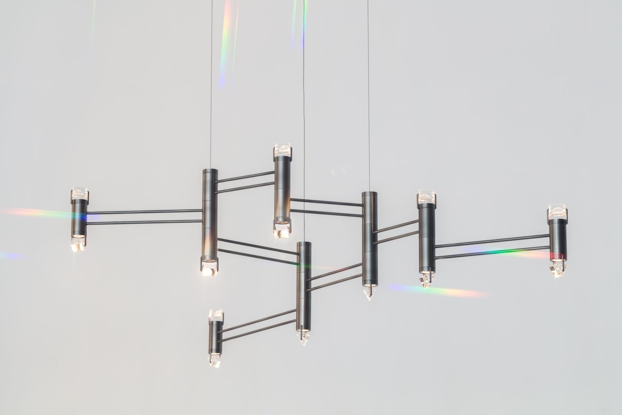 Aries was inspired by the artist Olafur Eliasson’s concept and set design for the ballet Tree of Codes where the dancers wore all-black suits highlighted with LEDs. The Polished Nickel stems create a minimal form to position bodies of light topped