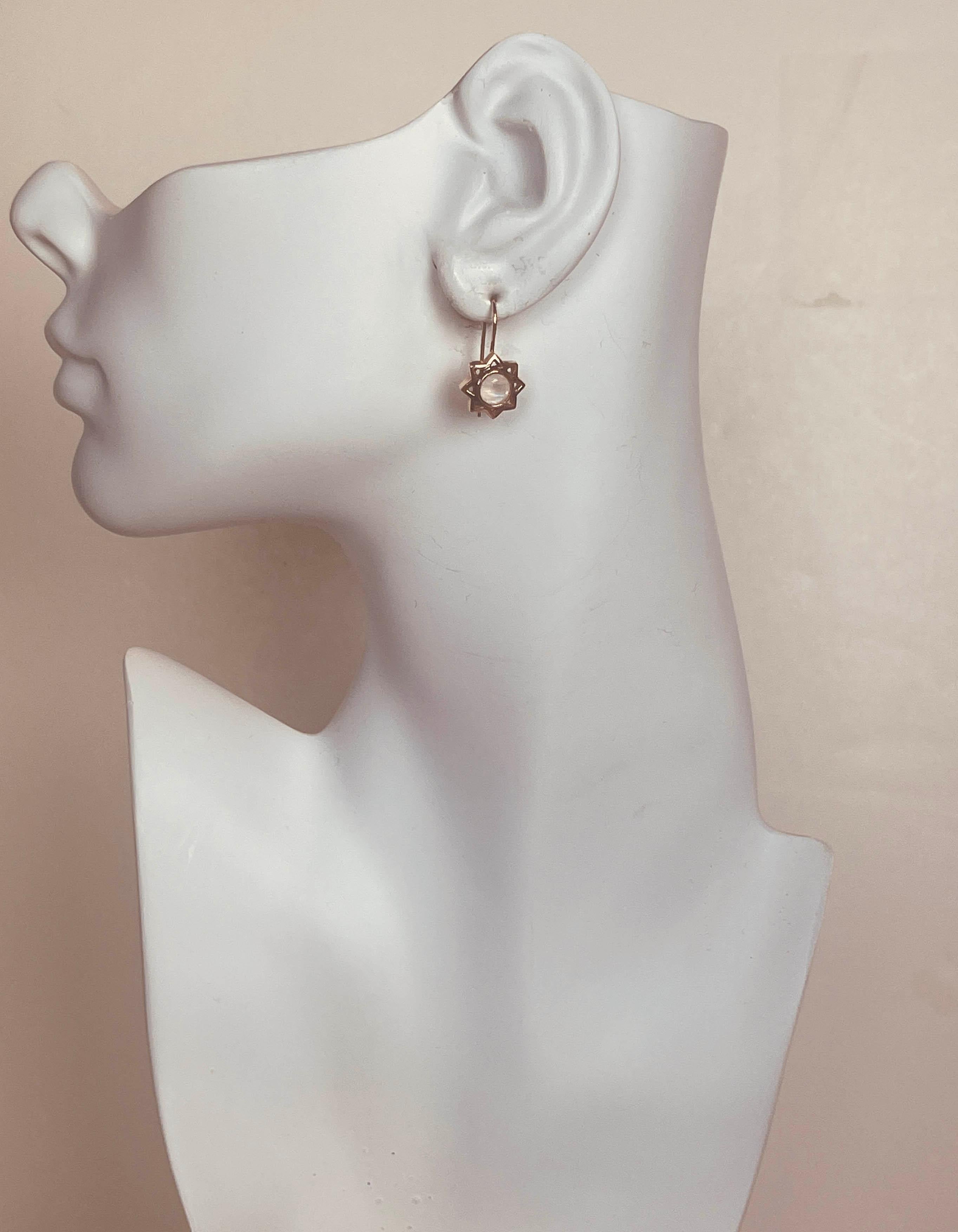 Arik Kastan 14K Rose Gold Moonstone Drop Earrings
Materials: 14K Rosegold & Moonstone
Hallmarks: 14K
Closure/Opening: Pierced wire
Overall Condition: Goldtone
Estimated Retail: $800

Measurements: 
Length: 1.5cm
Height: star: 1.5cm - total height: