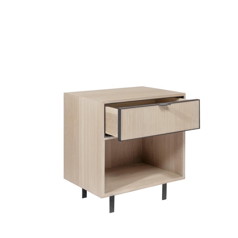 With modernist inspiration, the details in electrostatic paint steel doors and legs in the wood veneer Arista Nightstand generate its basic shape, functional lines, and curves. Production time: 6-8 weeks for items without marble / 13-14 weeks for