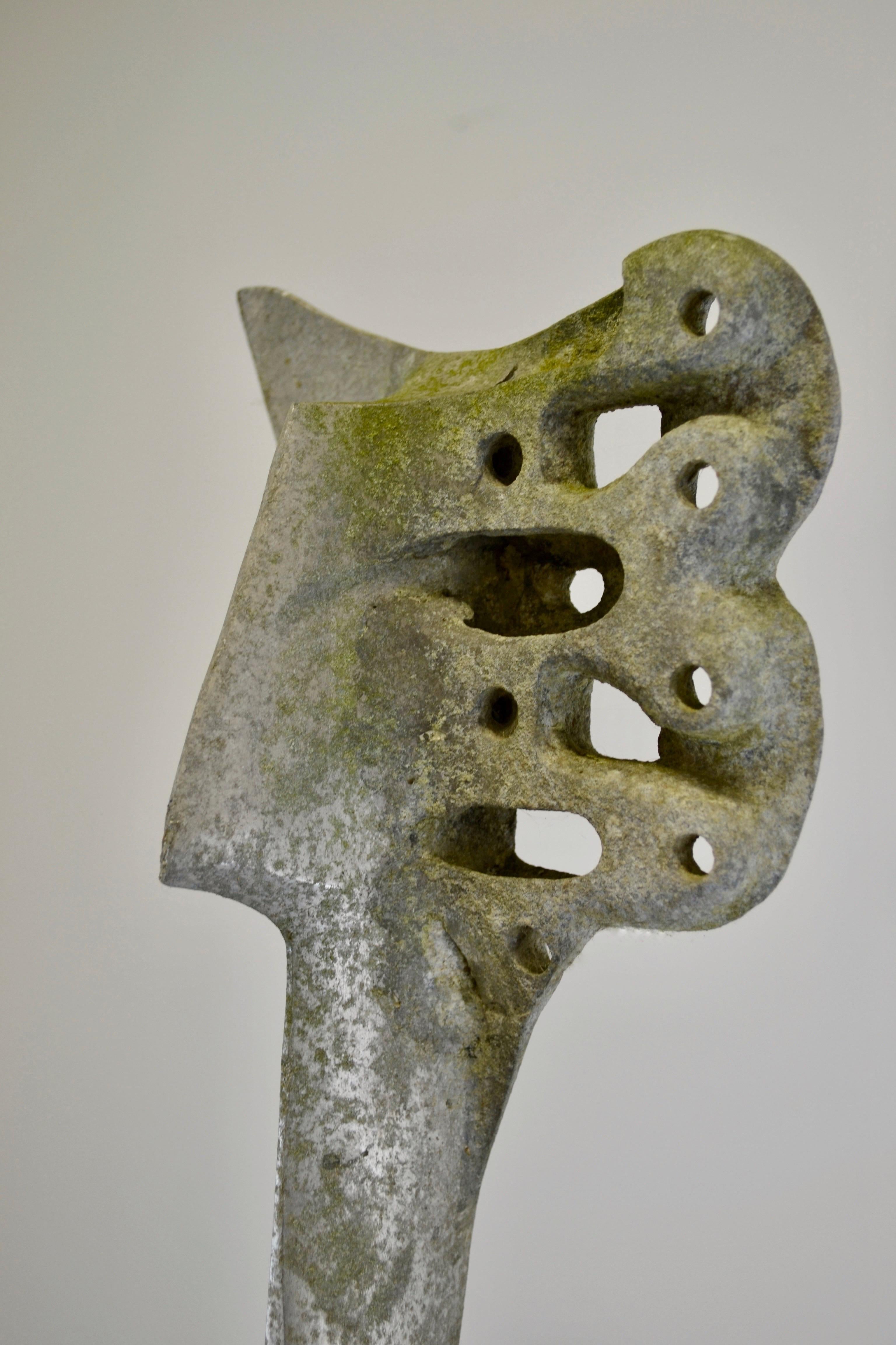 A stunning aluminum sculpture stamped 